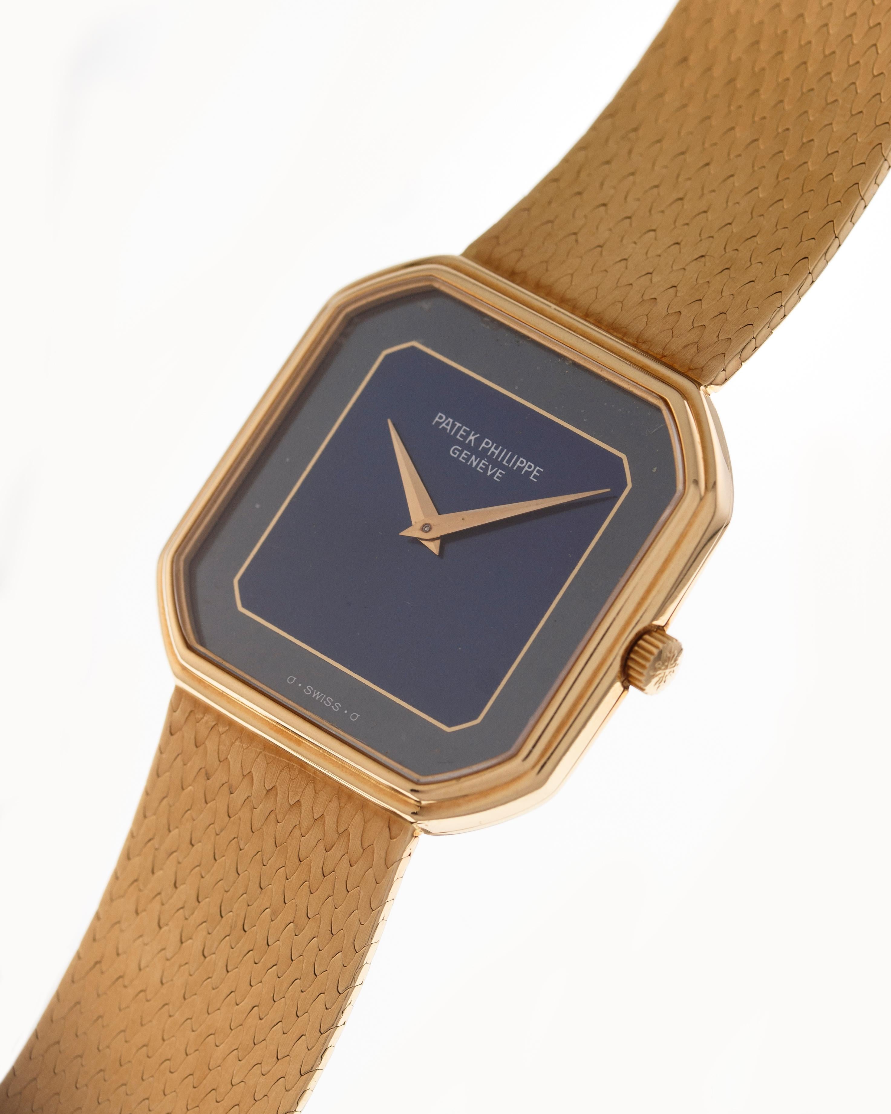 Case: square shape 34 mm in 18 kt yellow gold in two parts, snap in back and integrated yellow gold original bracelet.

Dial: two tone blue color dial without indexes and Dauphine hands 

Movement: manual winding 

Year: 1960's