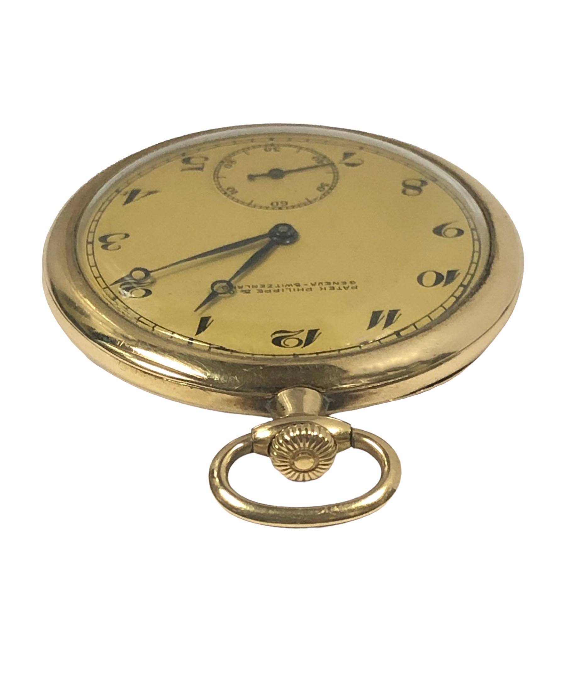 Circa 1920s Patek Philippe Pocket Watch, 44 M.M. 18k Yellow Gold 3 piece case with embossed Enamel initial design work on the case back. 18 Jewel, mechanical, manual wind nickle lever movement. Original and excellent Gold Gilt metal dial with sub