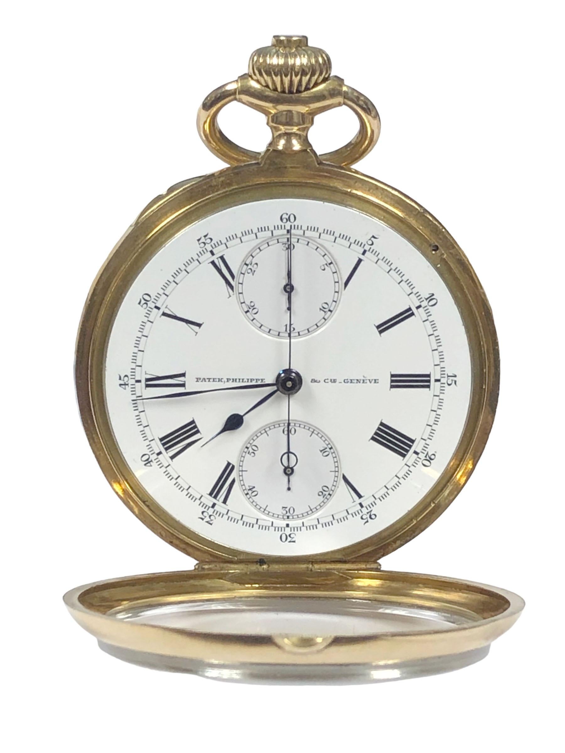 Circa 1909 Patek Philippe Open Face Chronograph Pocket Watch, 50 mm diameter 18k Yellow Gold 3 piece case with inside dust cover, White Porcelain Dial with Black Roman numerals, outer chapter ring calibrated for minutes, subdial for seconds at 6