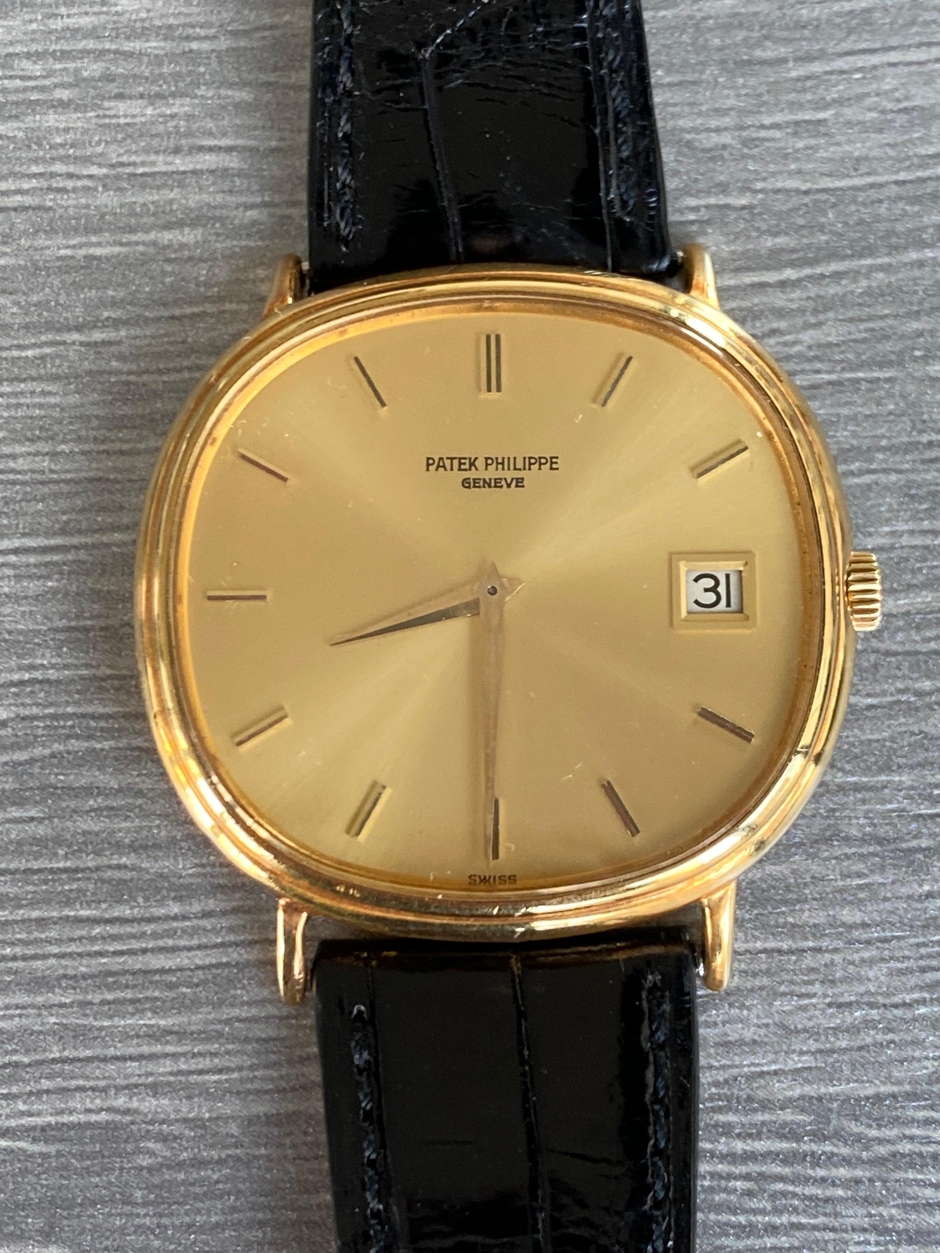 Preowned, excellent condition Patek Philippe Automatic Ellipse reference 3839 18k Yellow Gold gents wristwatch.Circa 1980’s. Gold dial, baton hour markers, date display at 3 o’clock, an 18k Yellow Gold 36mm case, bezel, winder and classic pin buckle