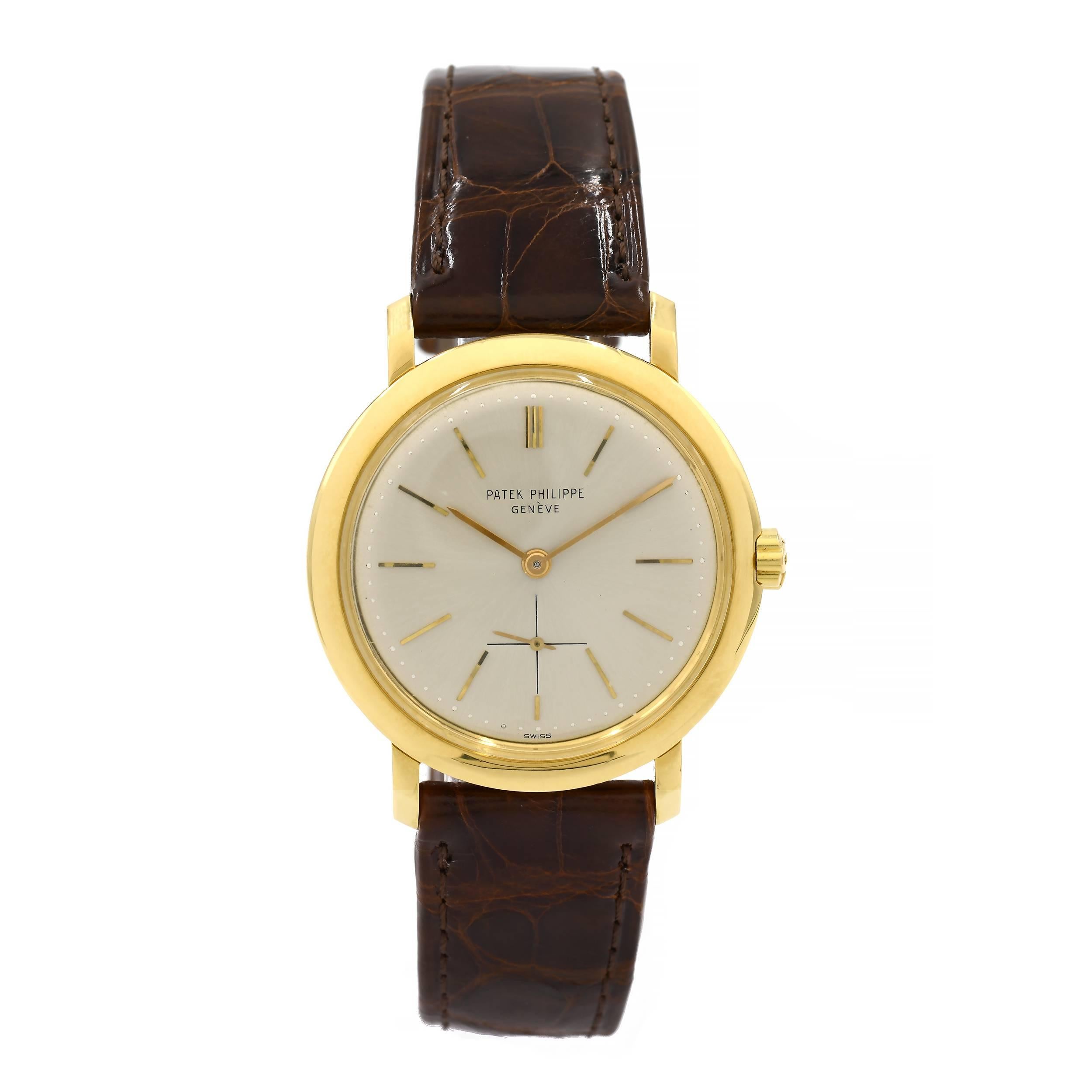  Patek Philippe  ref 3440 Calatrava wristwatch with original 18k Patek buckle and brand new Patek band. Screw down case back and automatic Patek movement.

18k yellow gold 
49.5 grams 
Length: 40.55mm 
Width: 34mm 
Band width at case: 18mm 
Case