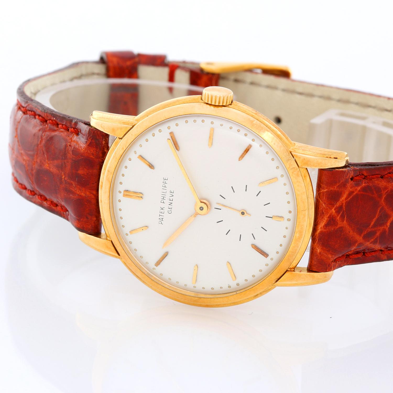 Patek Philippe & Co. 18K Yellow Gold  Calatrava Ref -  2484 J - Manual winding. 18K Yellow Gold ( 33 ) . Silvered dial with raised gold hour markers. Brown leather strap with tang buckle . Pre-owned with custom box. Circa 1960's .