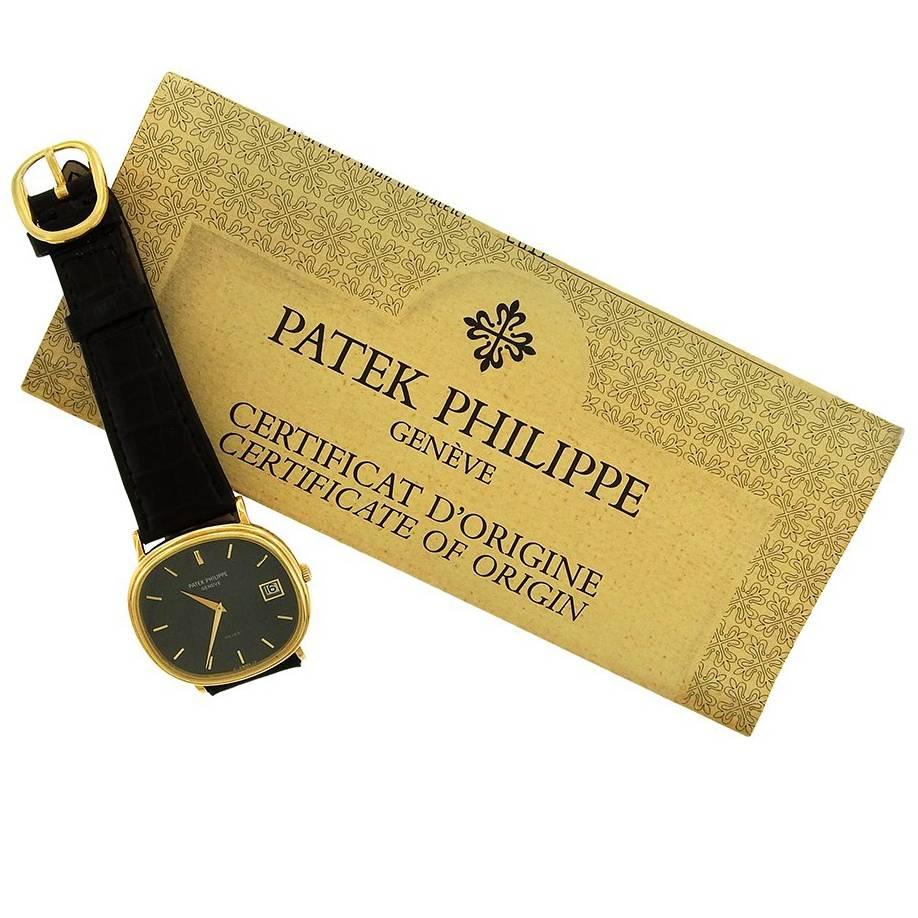Patek Philippe horizontal Ellipse, Ref. 3869, sold in 1984, is a 35mm x 39mm automatic calendar Ellipse with blue dial.  Solid back with double stepped bezel, metallic blue dial with date at 3, gold dauphine hands, applied gold baton hour markers.