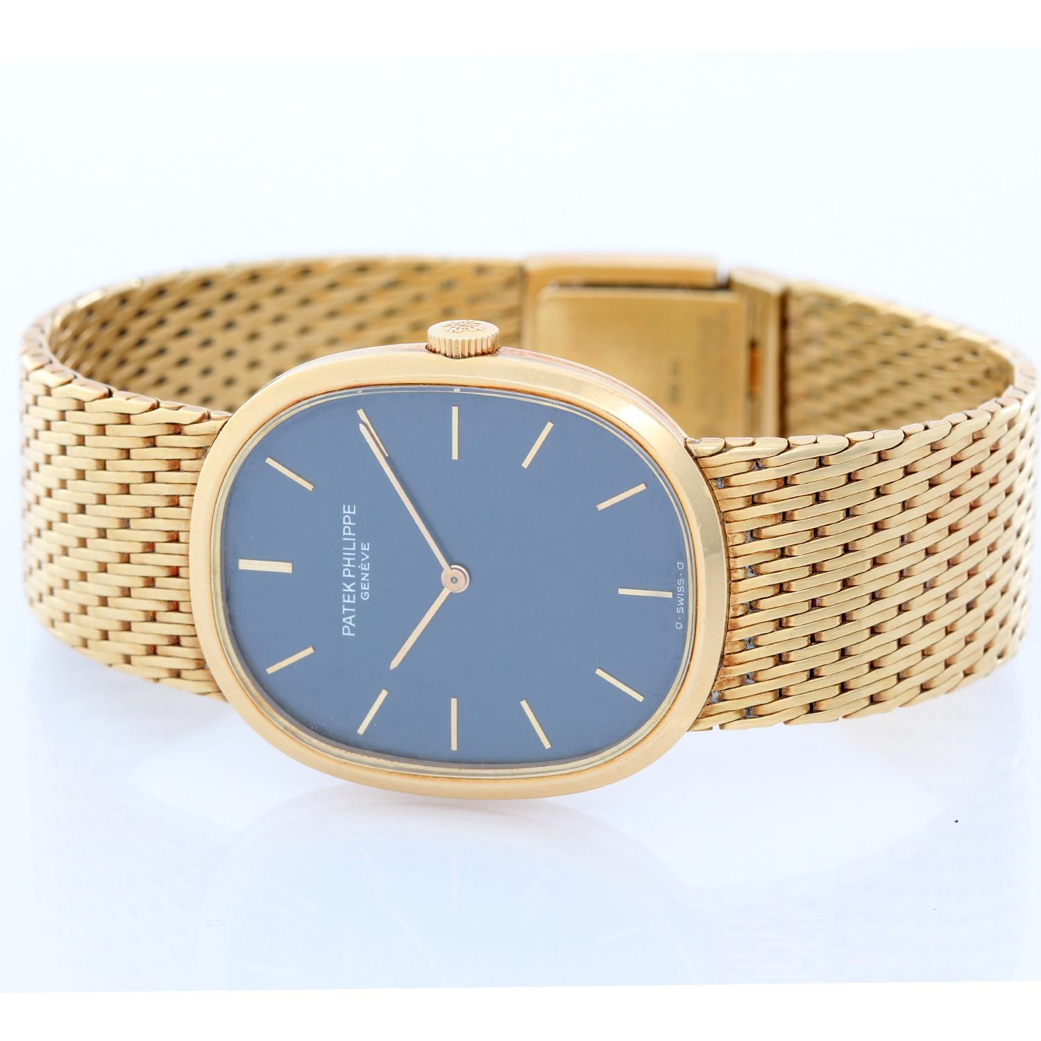 Patek Philippe 18k Yellow Gold  Ellipse Men's Watch Ref. 3848 -  Manual winding. 18k yellow gold case  (27mm x 32mm). Blue dial with gold stick markers. Yellow gold bracelet. Pre-owned with Patek Philippe box.This will fit a 6 3/4 inch wrist
