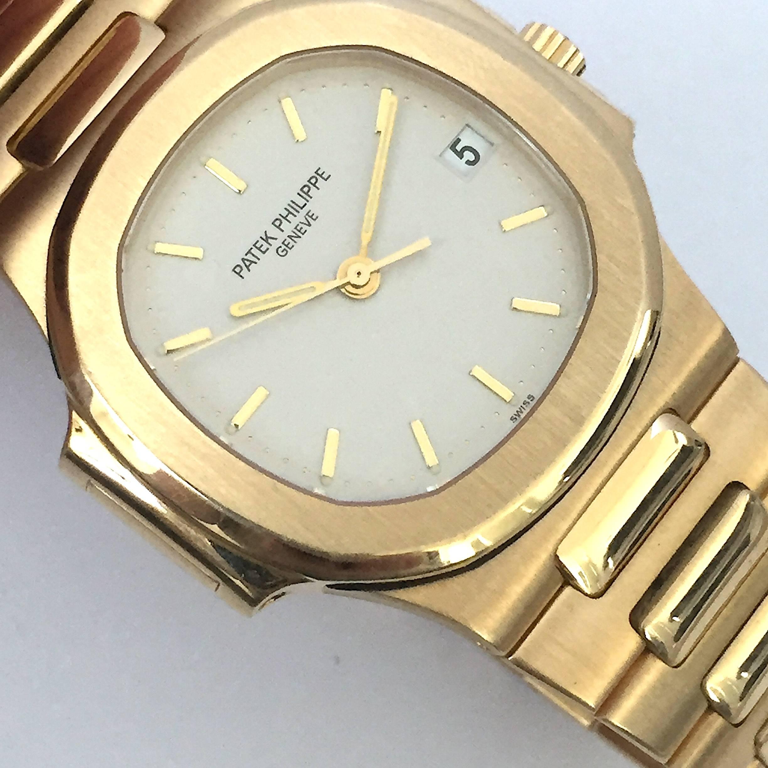 Patek Philippe Yellow Gold Nautilus Automatic Wristwatch In Excellent Condition For Sale In New York, NY