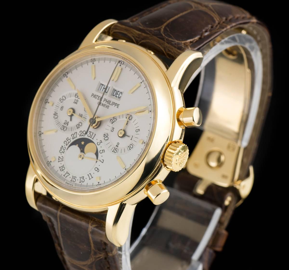An 18k Yellow Gold Perpetual Calendar Chronograph Gents Wristwatch, opaline silver dial with applied hour markers, 30 minute recorder and leap year indicator at 3 0'clock, date sub-dial and moonphase aperture at 6 0'clock, small seconds and 24 hour
