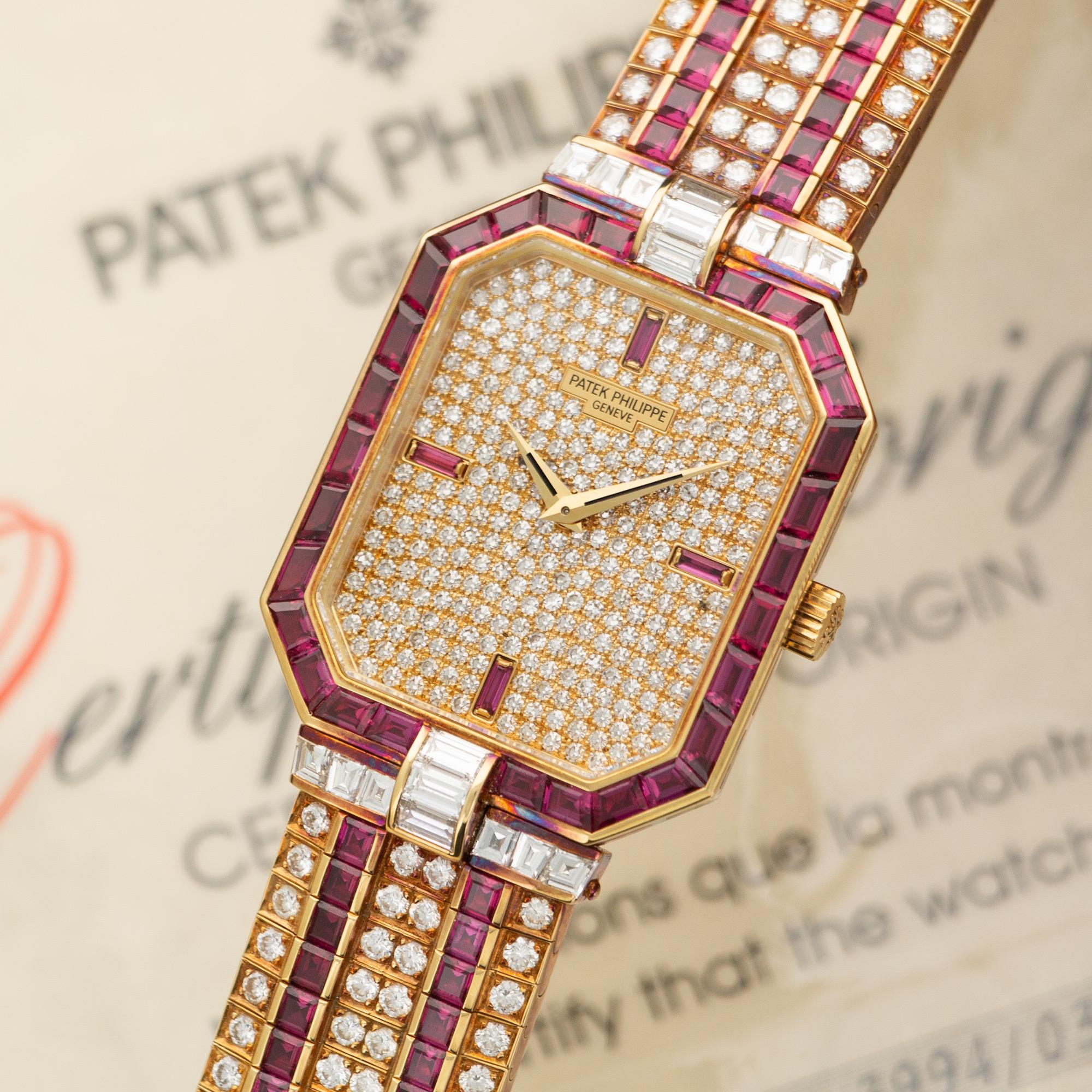 An 18k Yellow Gold Patek Philippe Watch with Original Diamonds and Rubies. Ref. 3994/033. 27mm Case Diameter. Manual Winding Movement. Accompanied by its Original Box and Papers. 