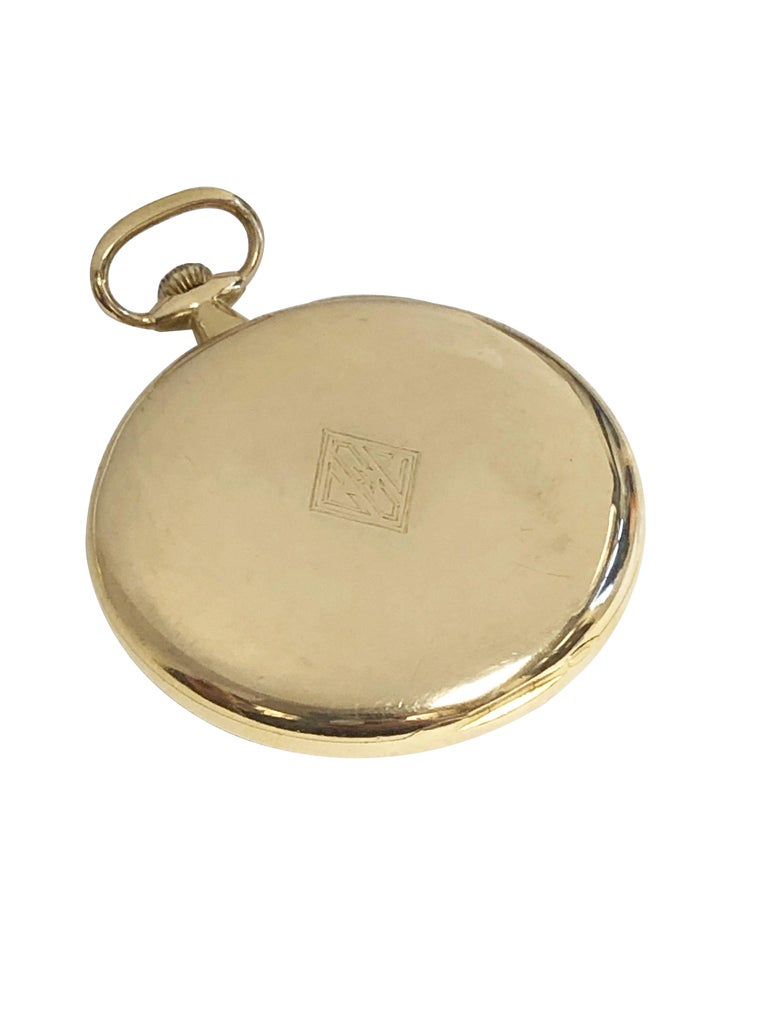 Circa 1920s Patek Philippe Pocket Watch, 45 M.M. X 9 M.M. thick 18K Yellow Gold 3 piece hinged case with Gold inside Dust cover. 18 Jewel mechanical, Manual wind nickle lever movement. Original, mint excellent condition Gold satin dial with Black