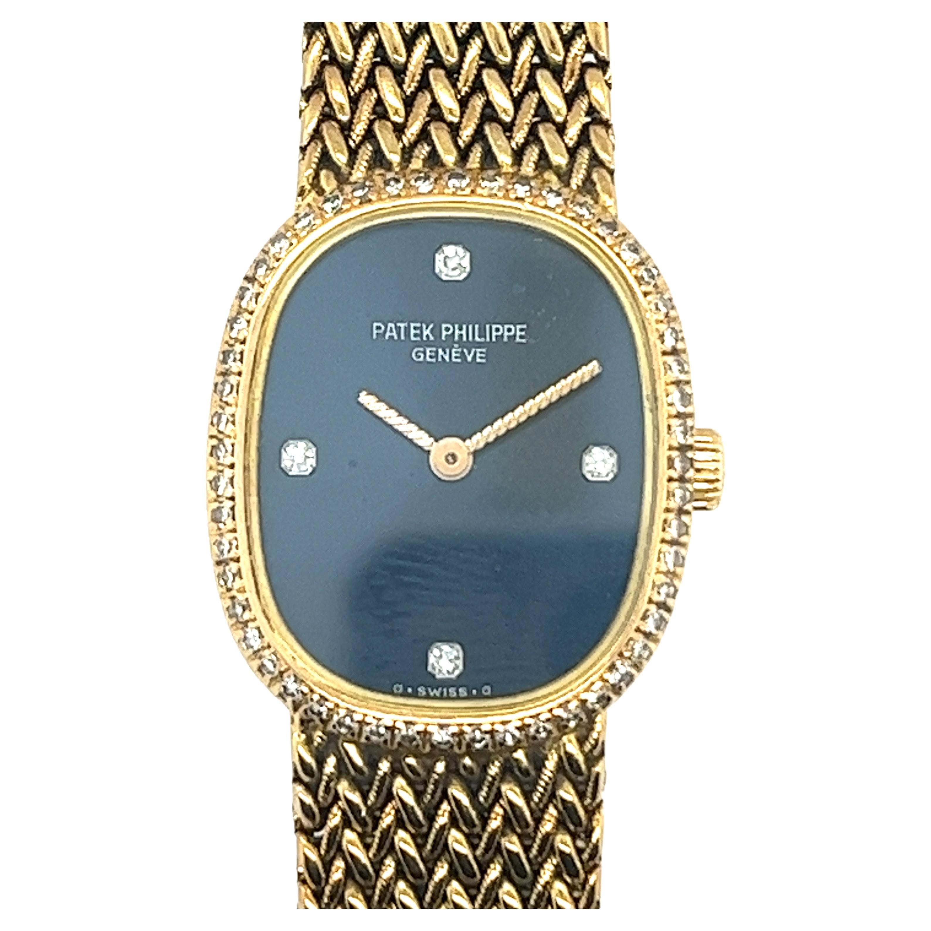 This stunning  Pre-owned Yellow Gold Ladies Patek Philippe Nautilus (4700/3j-050). This particular model Has A 27mm case size, A black-blue diamond dot dial housing and a date aperture At 3 O'clock. Surrounding the face are brilliant cut diamonds. 