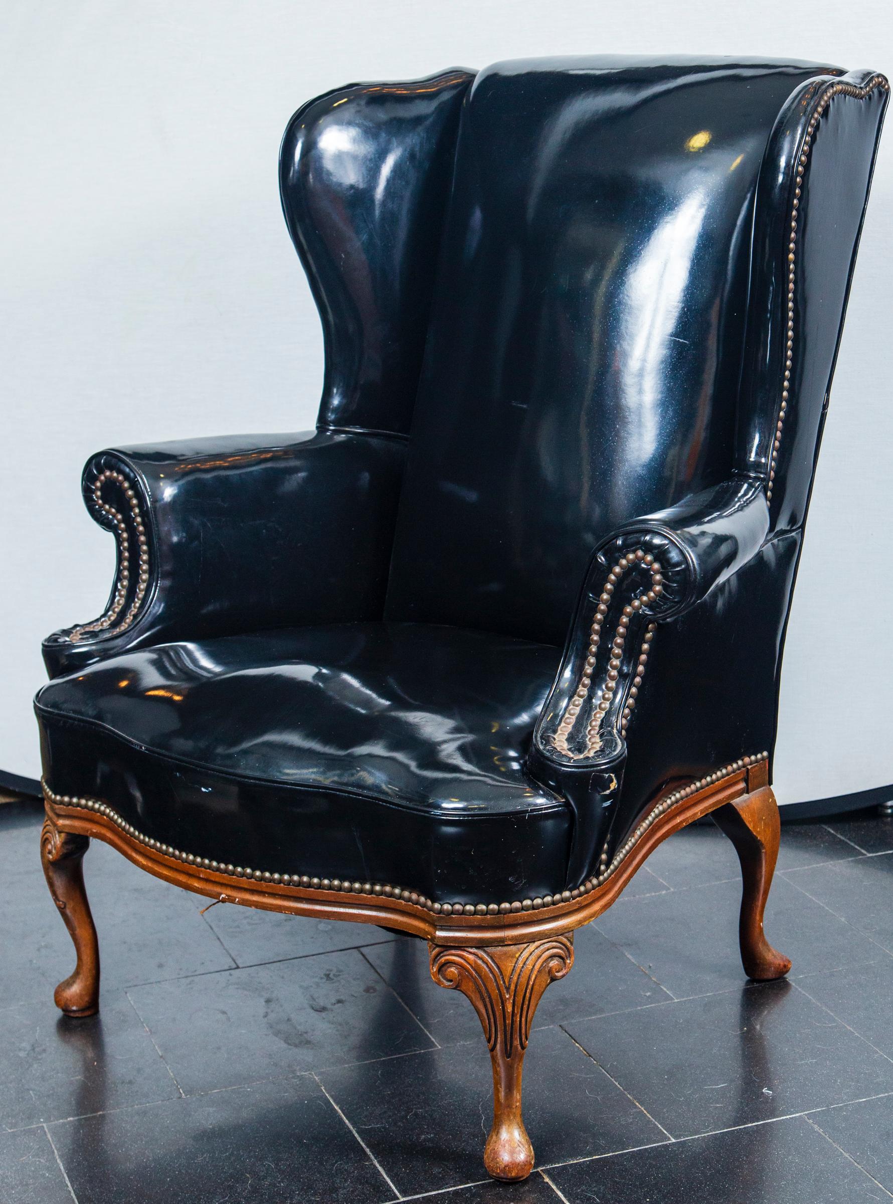 Patent leather wing chair.
