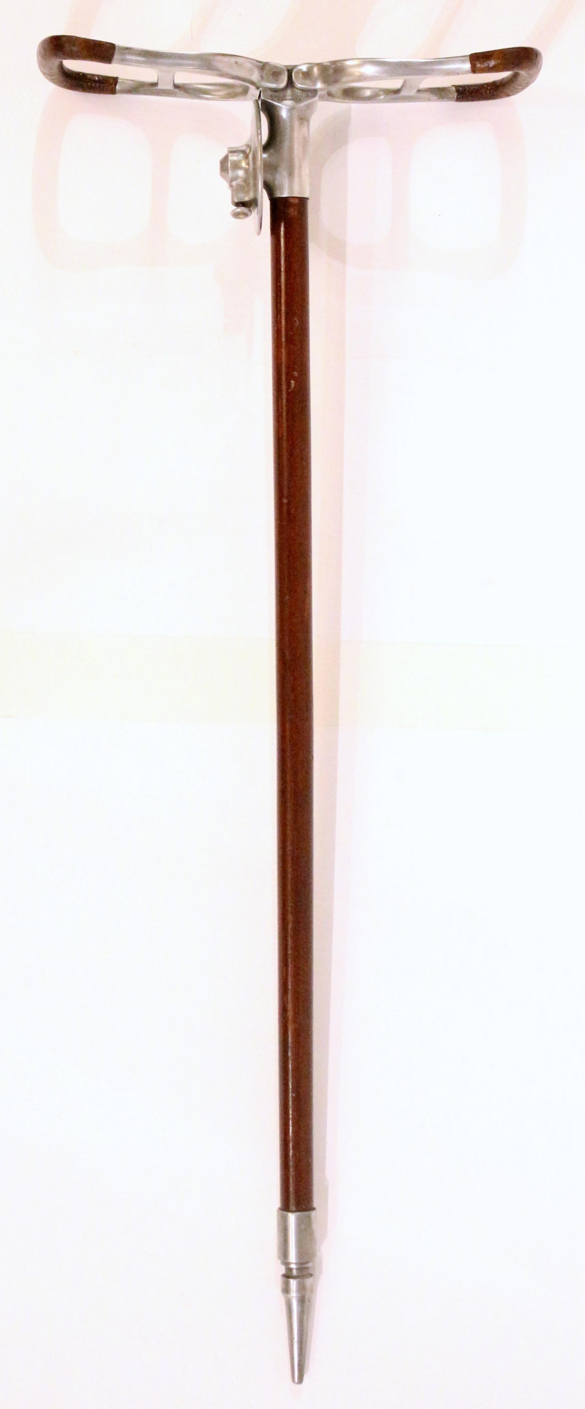 Patented field sporting event or hunting walking stick with folding seat by Mills Munitions Ltd., Birmingham, England. Early-mid 20th century. Steel with mahogany shaft; leather wrapped handles for seating.
4.5