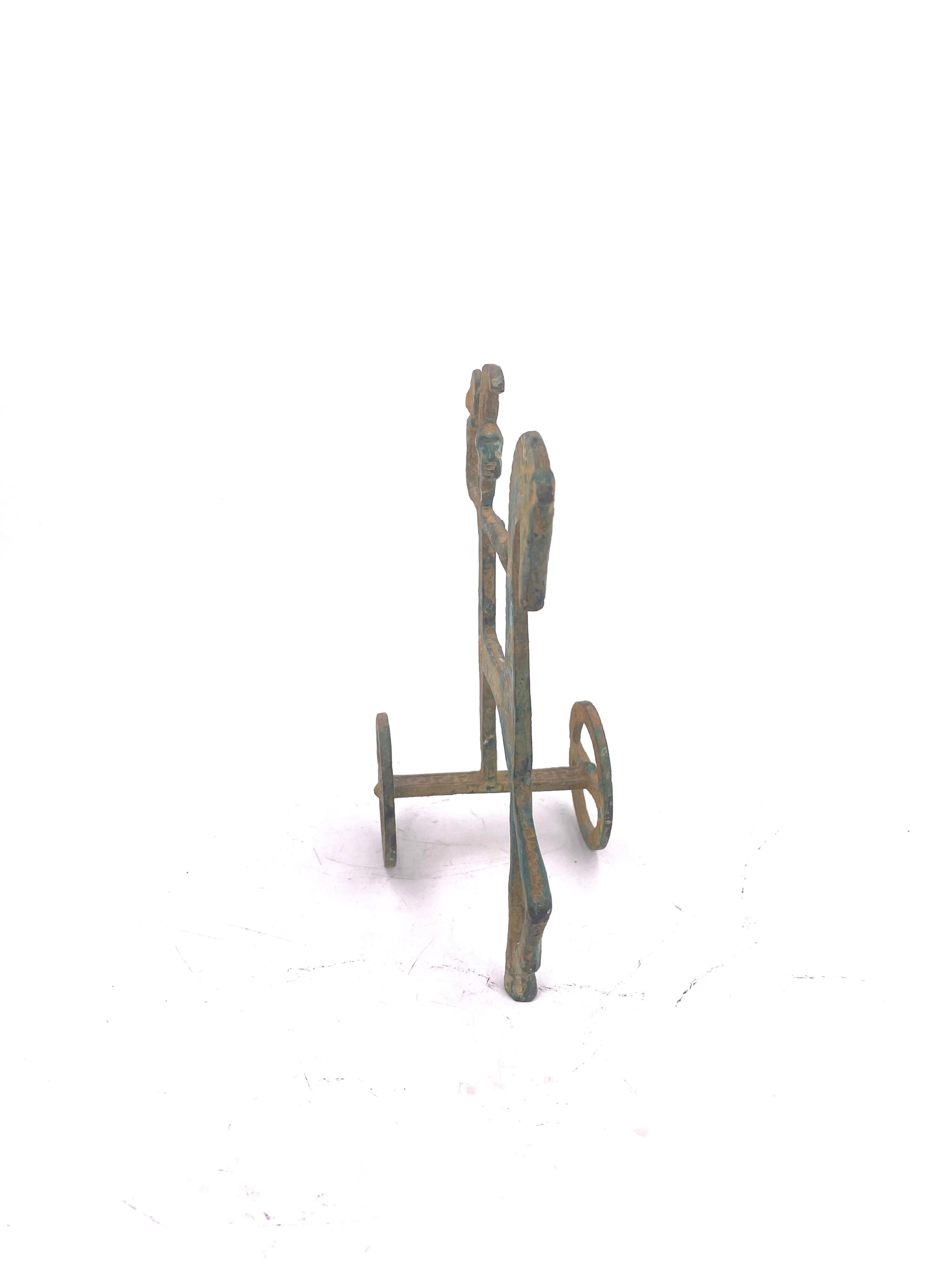 Simple and elegant Etruscan patinated metal horse and chariot sculpture in the style of Frederick Weinberg, circa the 1970s. Minimalist and modern, this piece has nice etched detailing and is perfect for an office or mantel.