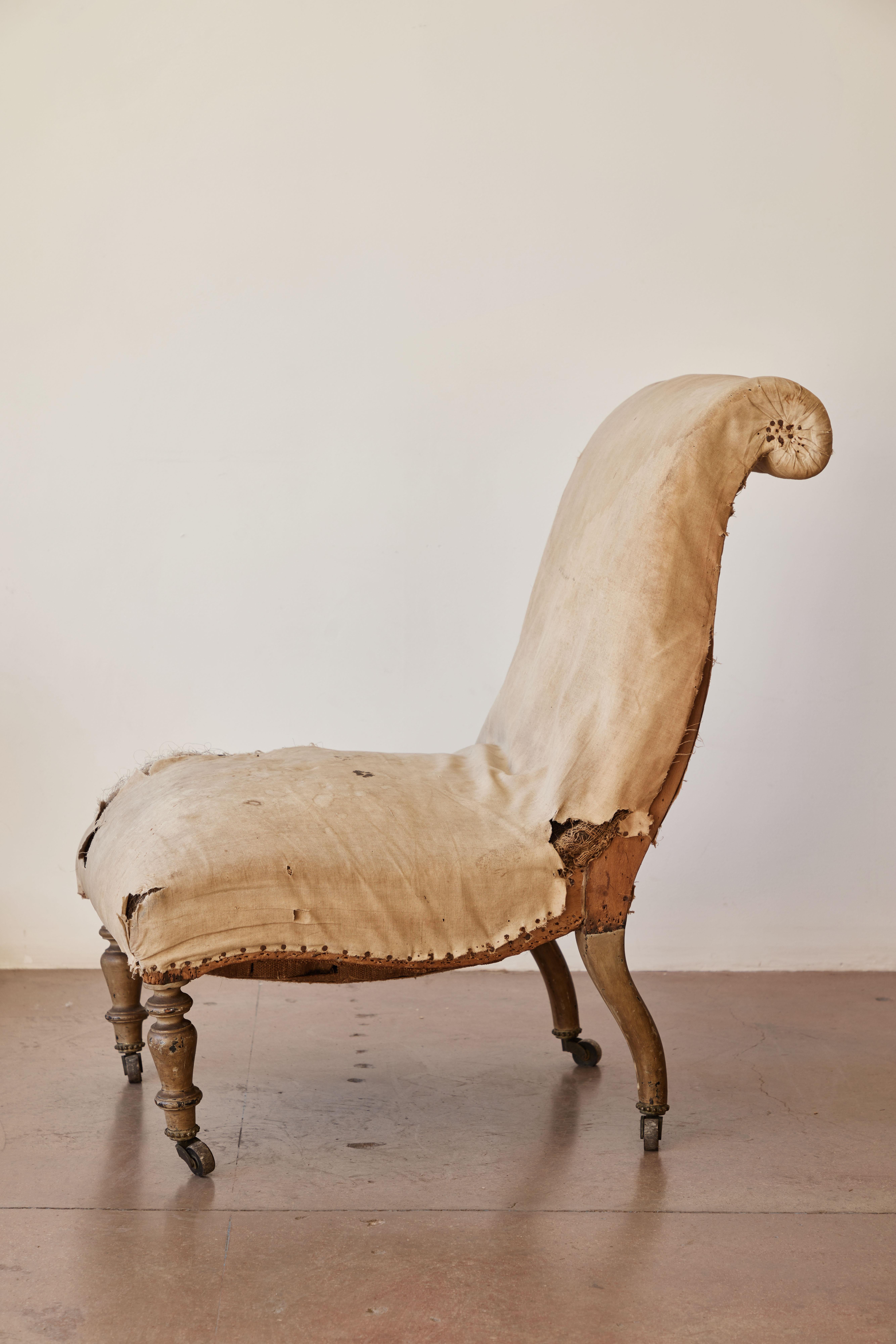 Napoleon III slipper chair with original upholstery and patina. Made in France, circa 19th century.