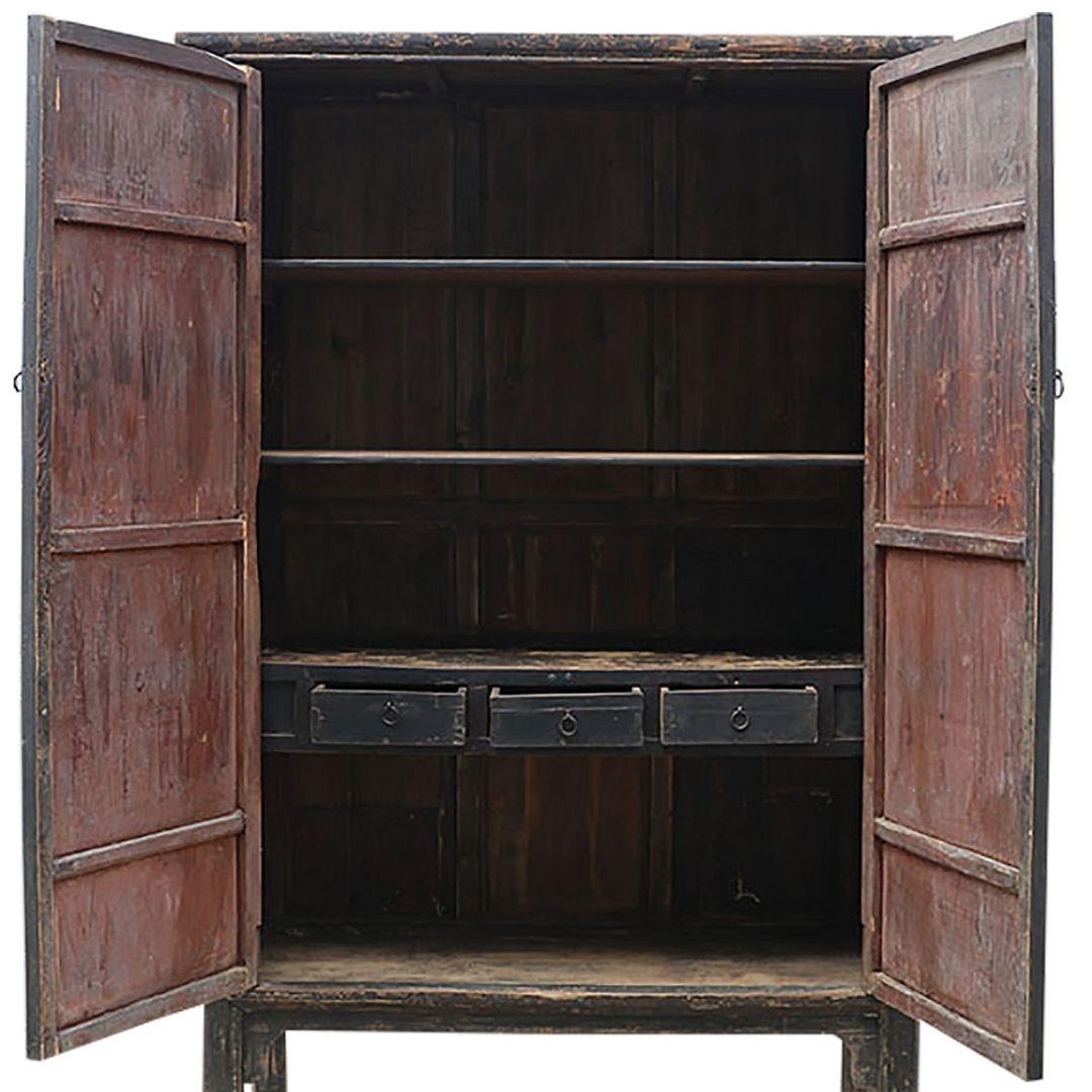 Discover a piece of history with this exquisite 19th-century cabinet from China's Shanxi province. Key features include:

Authentic: Over 100 years old wood
Material: Handcrafted elm wood
Colour: Rich black/brown patina
Design: Two-doors with metal