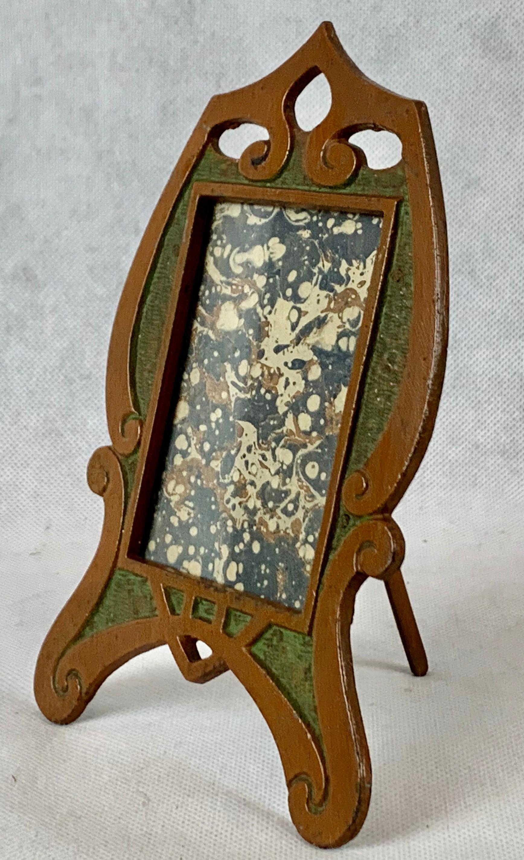 An Art Nouveau patinated and enameled photo or picture frame. A fine simplified example from this period without female forms and flowing vines and flowers. There is an easel back.
Measures: Height 5.5
