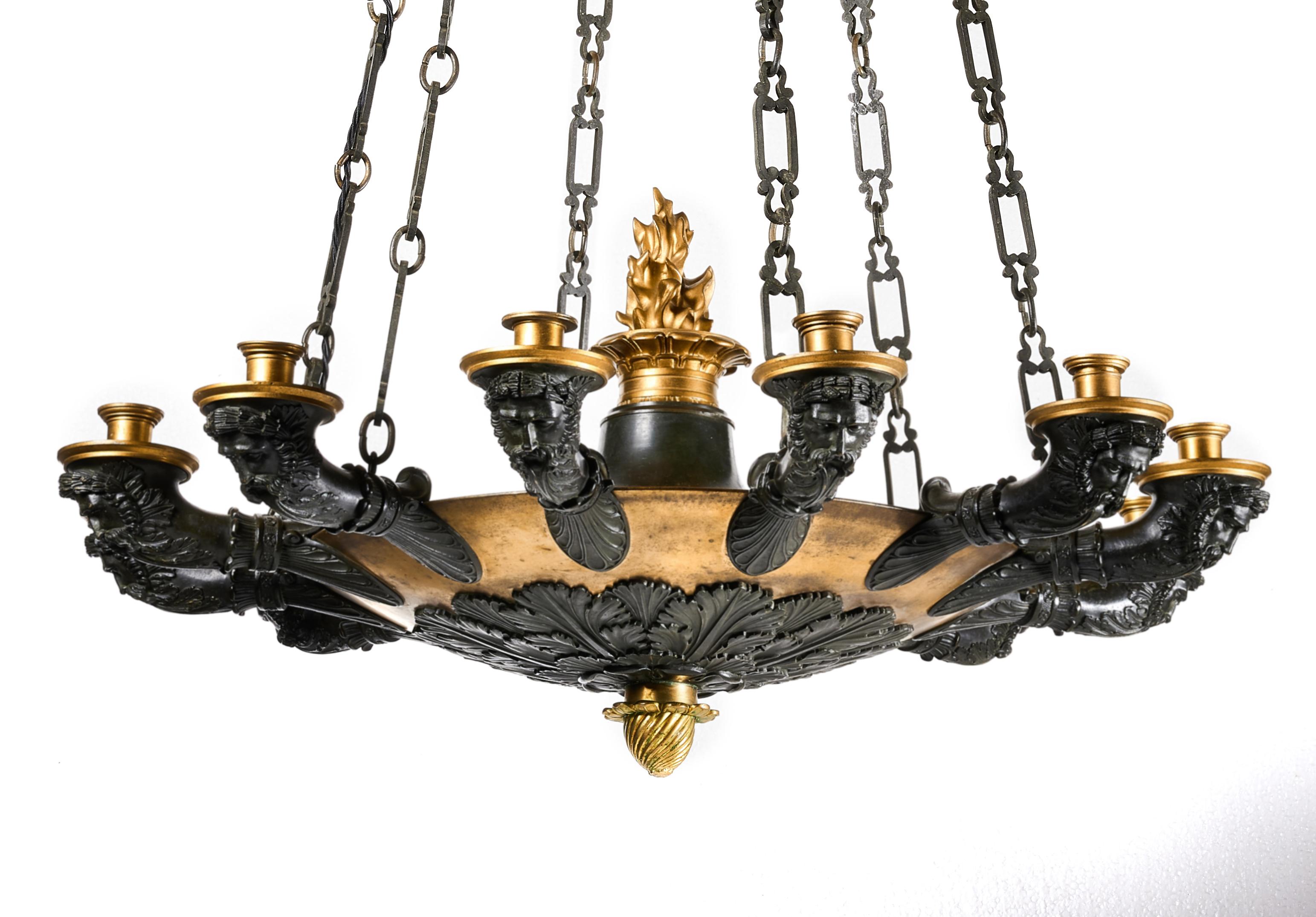 A superb quality original patinated and gilt bronze French Empire twelve-branch chandelier.

French, circa 1820.

In excellent original condition having a fine patina to the bronze and gilt work this wonderful 12 branch French Empire chandelier