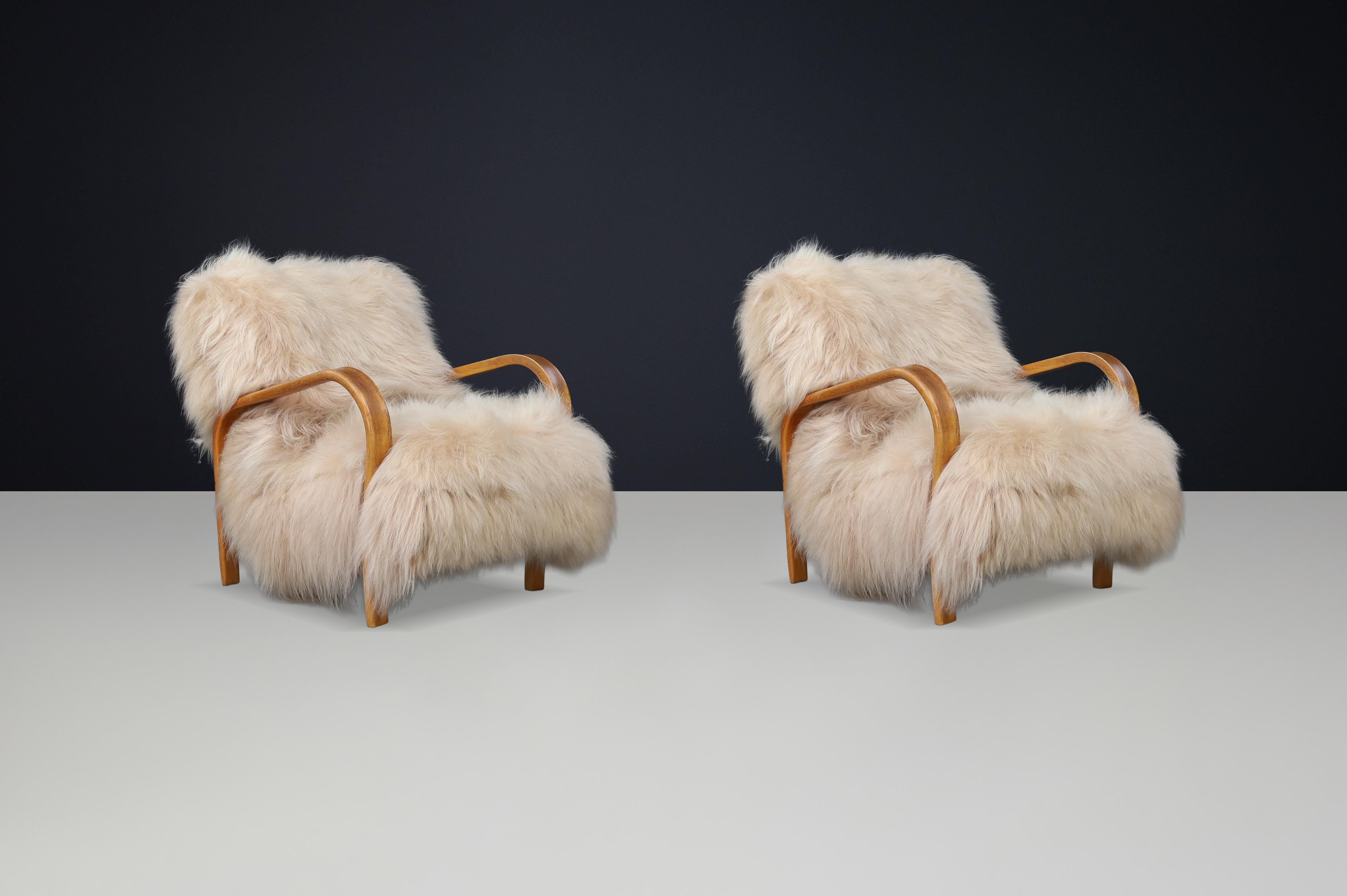 Mid-Century Modern Patinated Bentwood Lounge Chairs by Kozelka & Kropáček in Long-Haired Icelandic For Sale