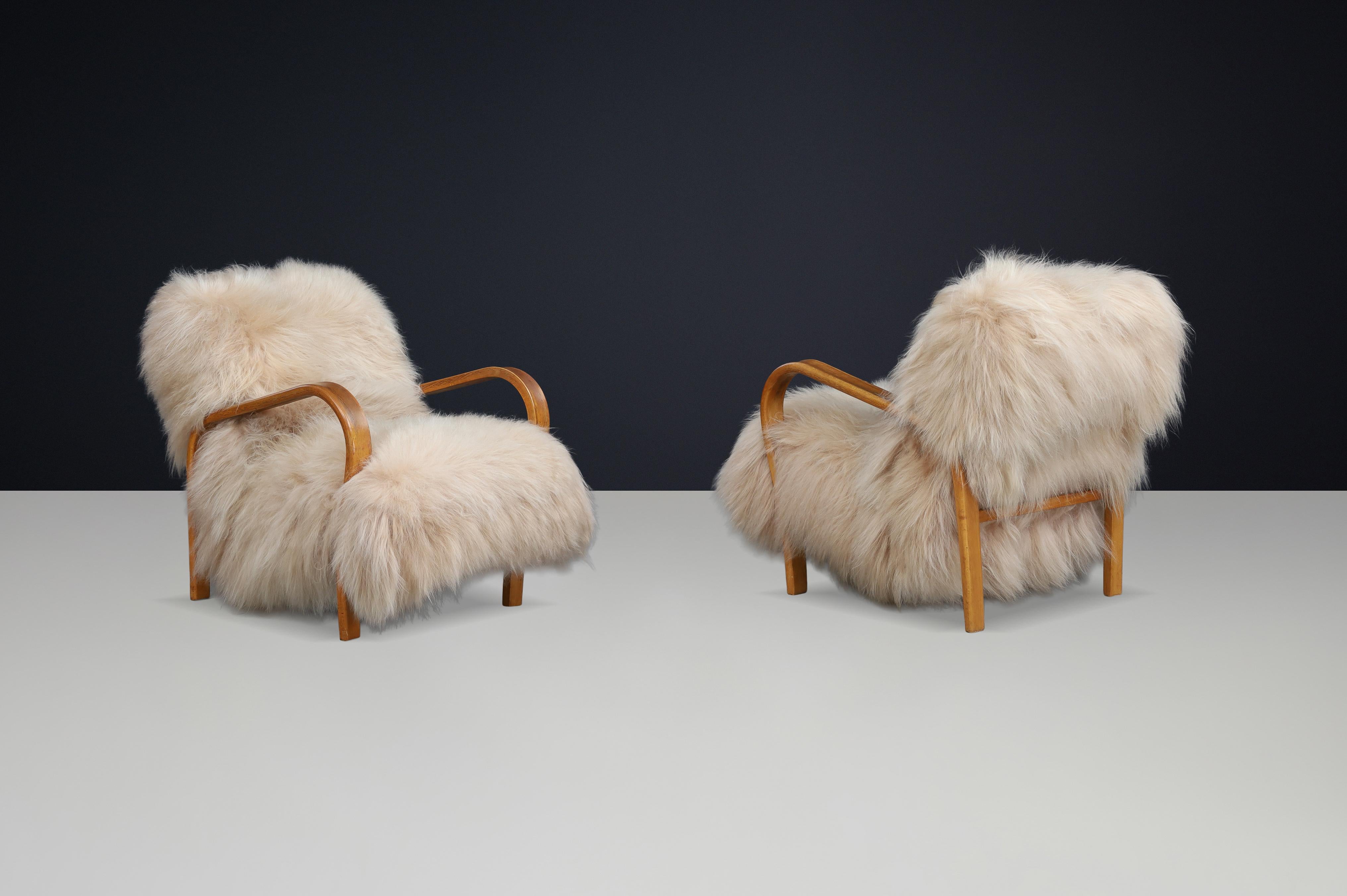 20th Century Patinated Bentwood Lounge Chairs by Kozelka & Kropáček in Long-Haired Icelandic For Sale