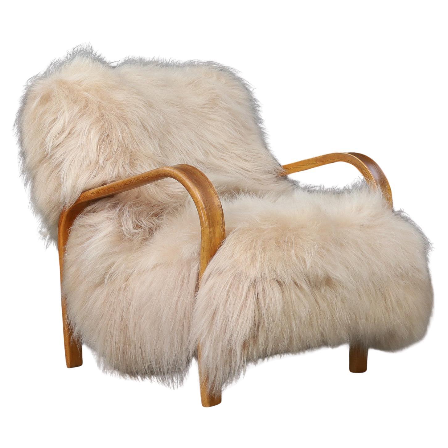 Patinated Bentwood Lounge Chairs by Kozelka & Kropáček in Long-Haired Icelandic. For Sale