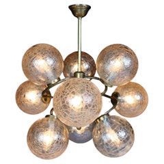 Vintage Patinated Brass Chandelier Wit Nine Amber-Colored Globes, Germany 1960s