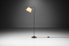 Patinated Brass Floor Lamp with Curved Neck, Europe first half of 20th century