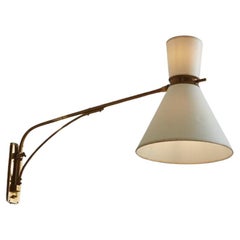 Patinated Brass Pivoting Arm Sconce in the Style of Robert Mathieu, France 1950s