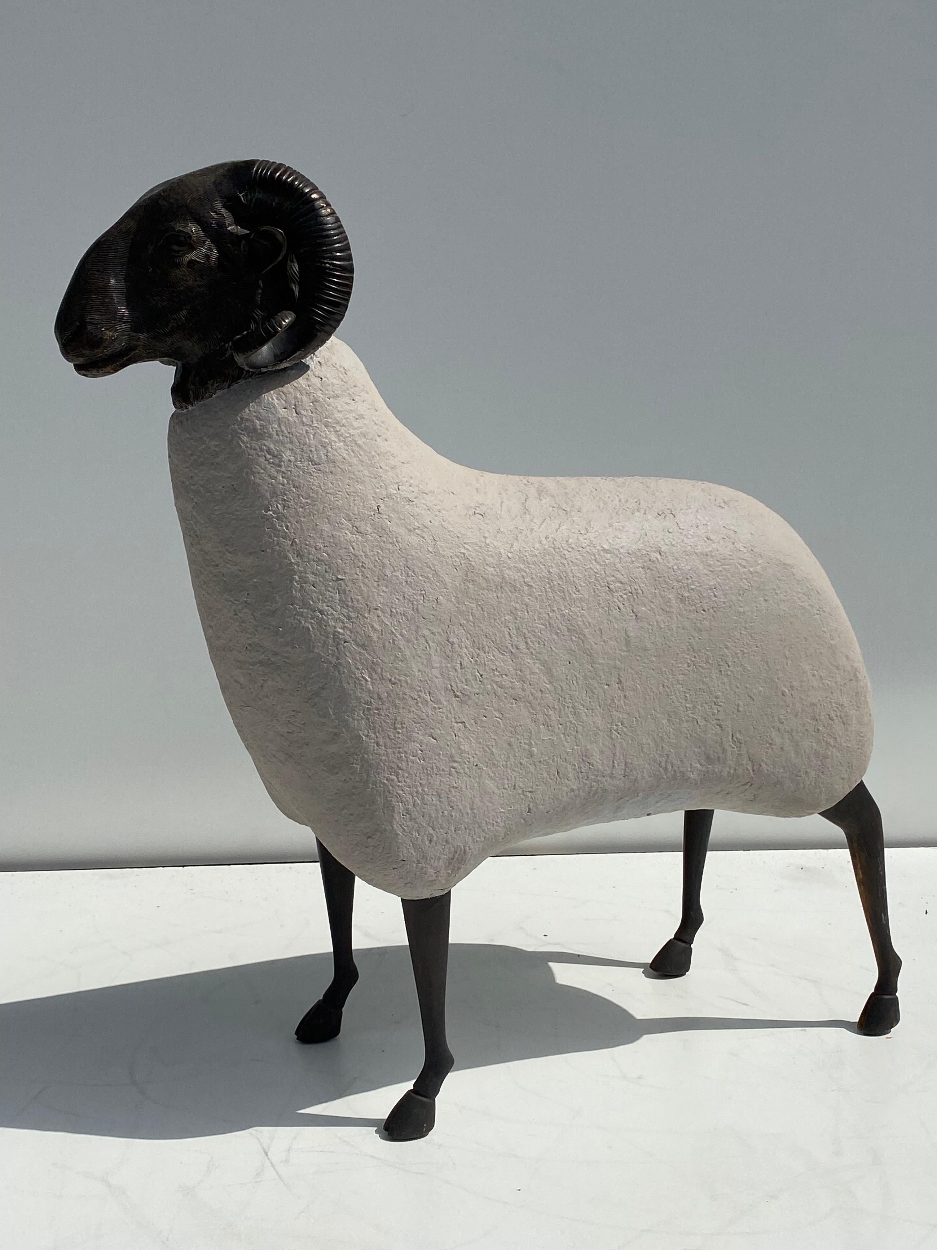 Patinated brass and faux concrete sheep / ram sculpture. Suitable for outdoors but not advised to leave under direct rain for a long period of time.