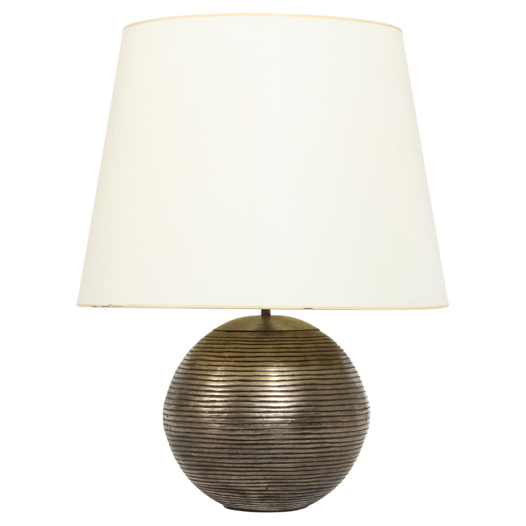 Grooved brass spherical lamp in patinated brass. Shade is for photographic purposes.
