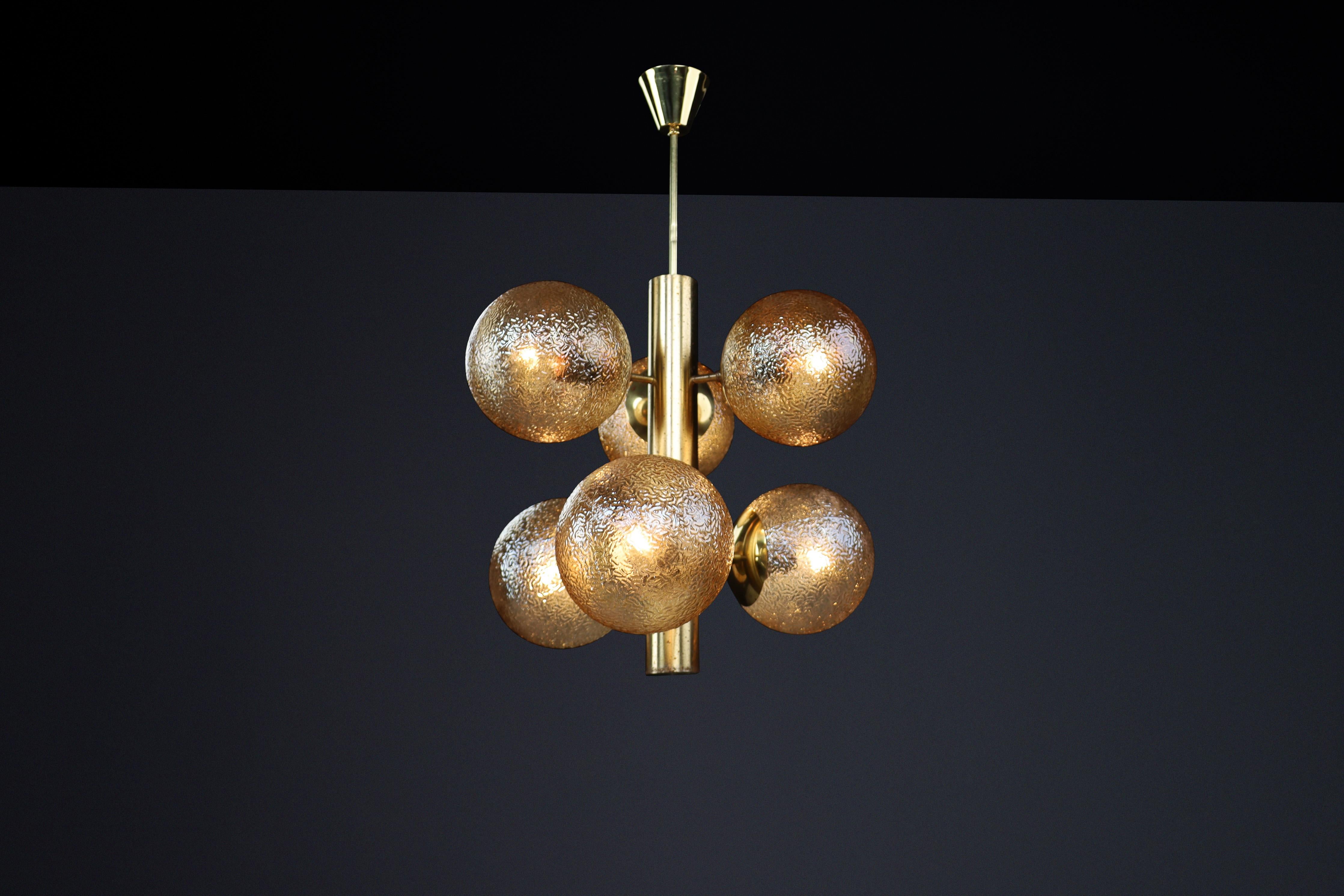 Patinated Brass Sputnik Chandelier with Six Gold-Colored Globes, Germany 1960s

This mid-century Sputnik chandelier represents a remarkable example of design excellence, crafted by Kaiser Leuchten in Germany during the 1960s. It features nine