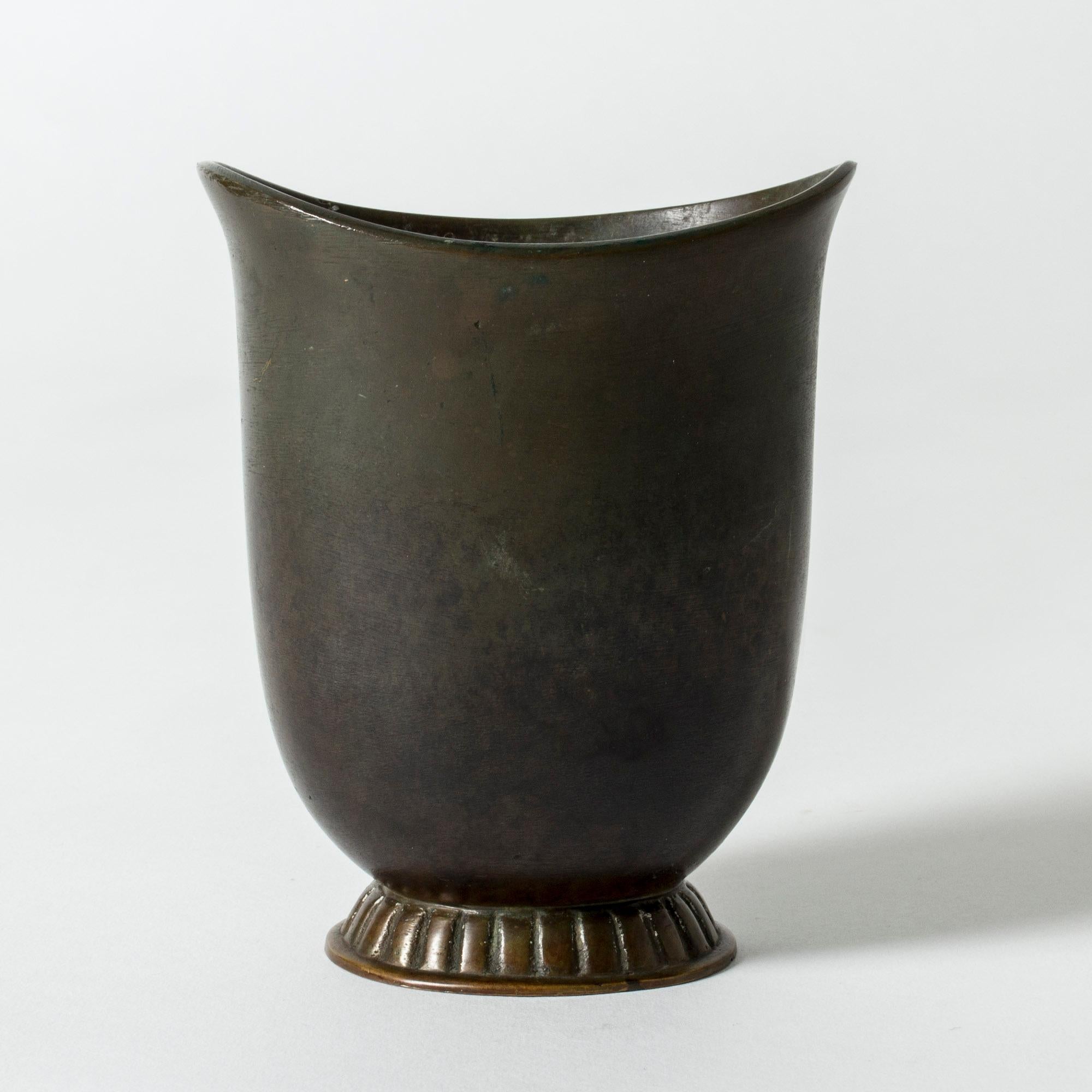 Elegant, small bronze vase from GAB, patinated dark green. Large mouth makes it great for a bouquet of flowers. The ornate base breaks off the strict design.

GAB was founded in Stockholm in 1867 and was an important influence on the Swedish art