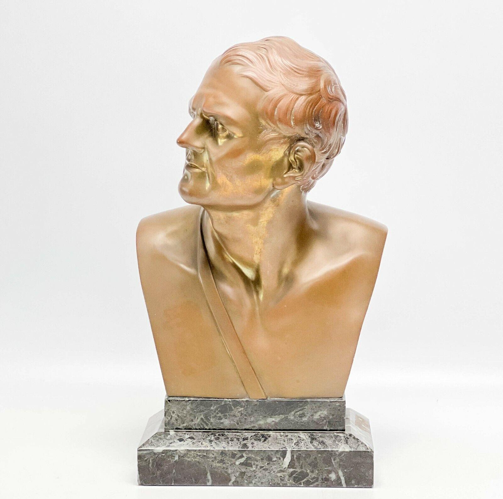 19th century patinated bronze bust of a man, likely a historical figure. Authorized bronze cast by Musee du Louvre. Mounted on a marble base. Inscribed 