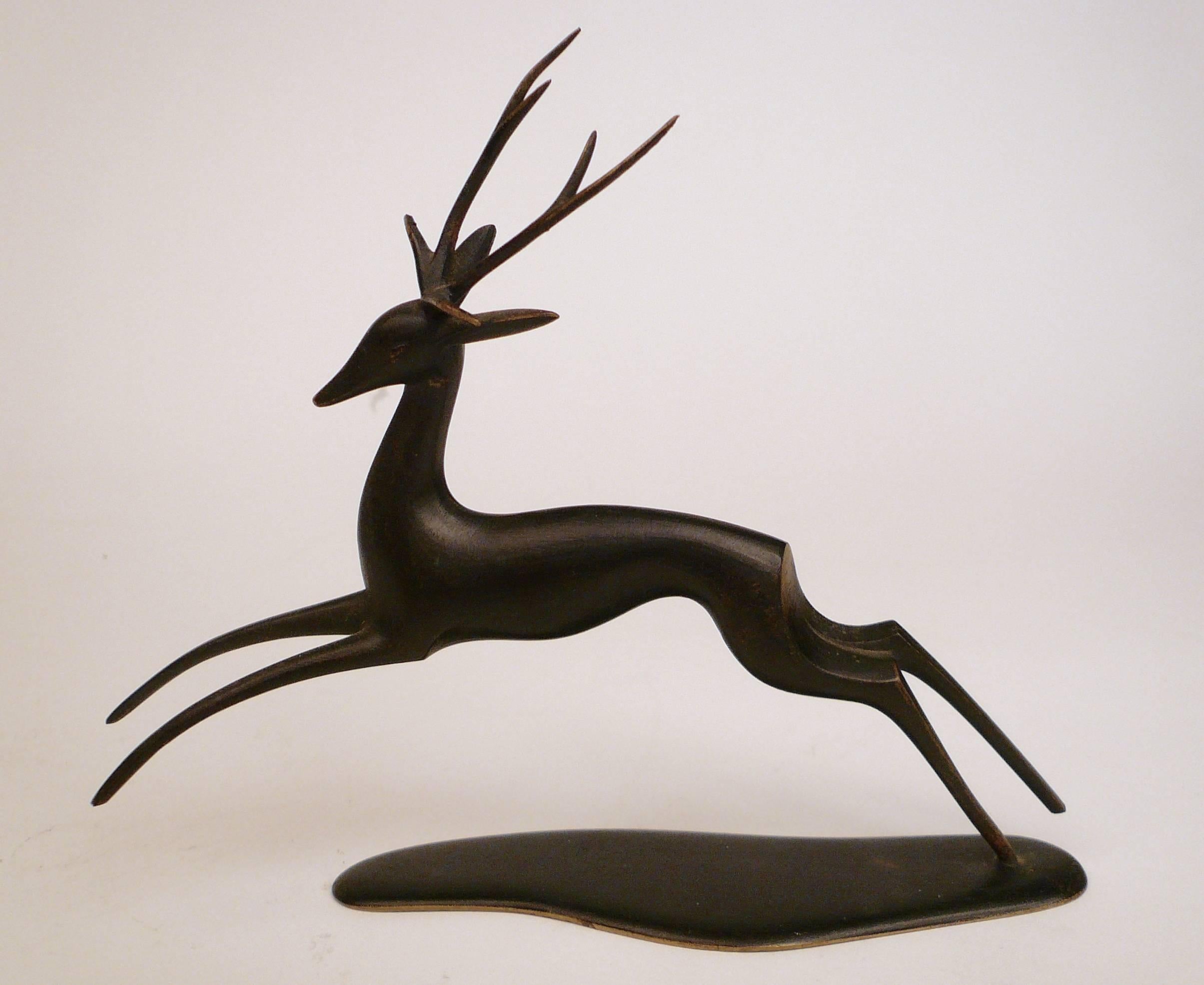 This high style sculpture of a leaping stag was handmade in the famed Werkstatte Hagenauer, Wien.