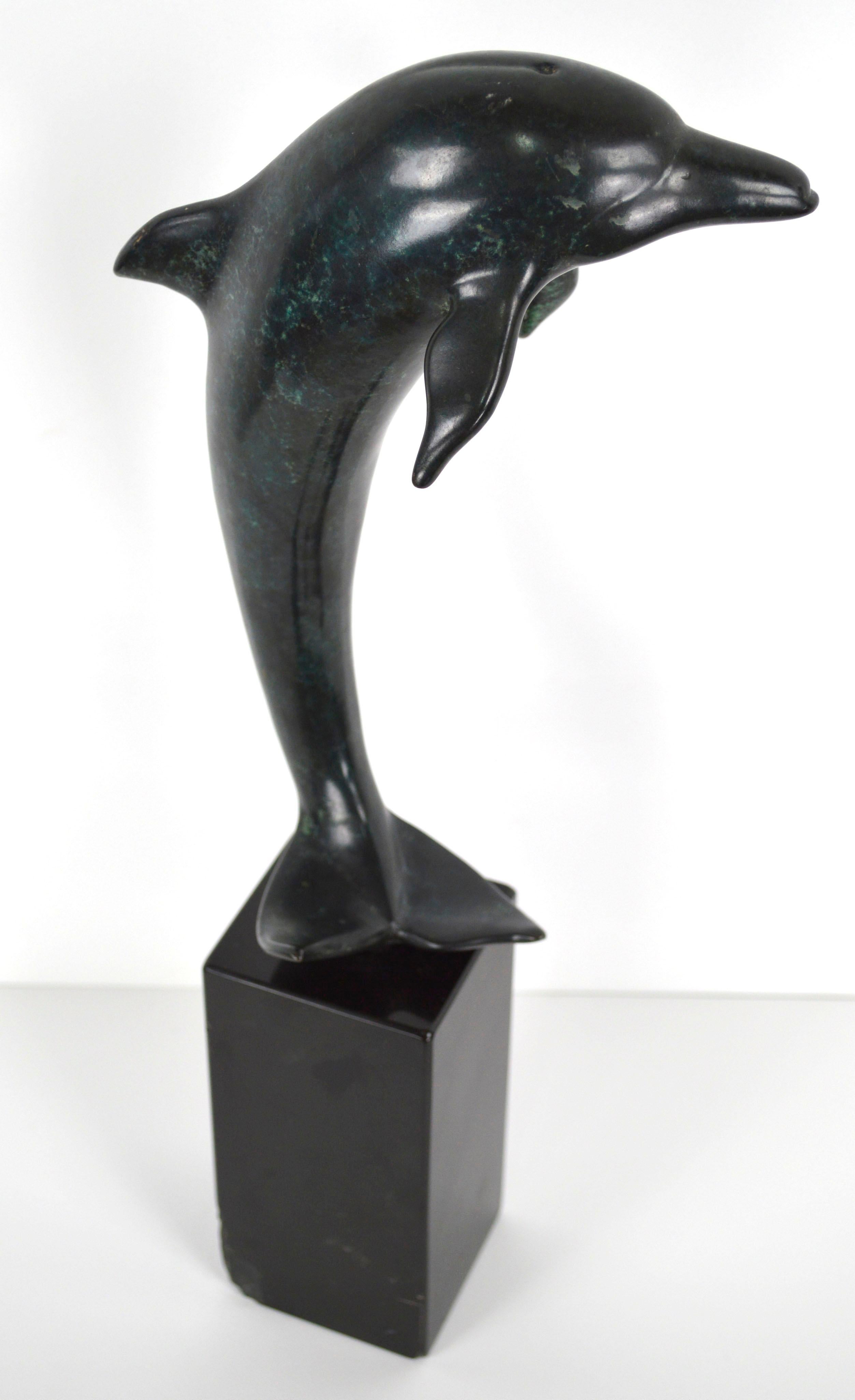 Contemporary Patinated Bronze Dolphin Sculpture

Elegant patinated cast bronze dolphin sculpture on granite base by renowned sculptor John Jagger (American, d.2013). Artist has etched signature and edition number on underside of tail fin, 