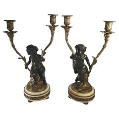 Patinated Bronze Figural Putti Candelabras