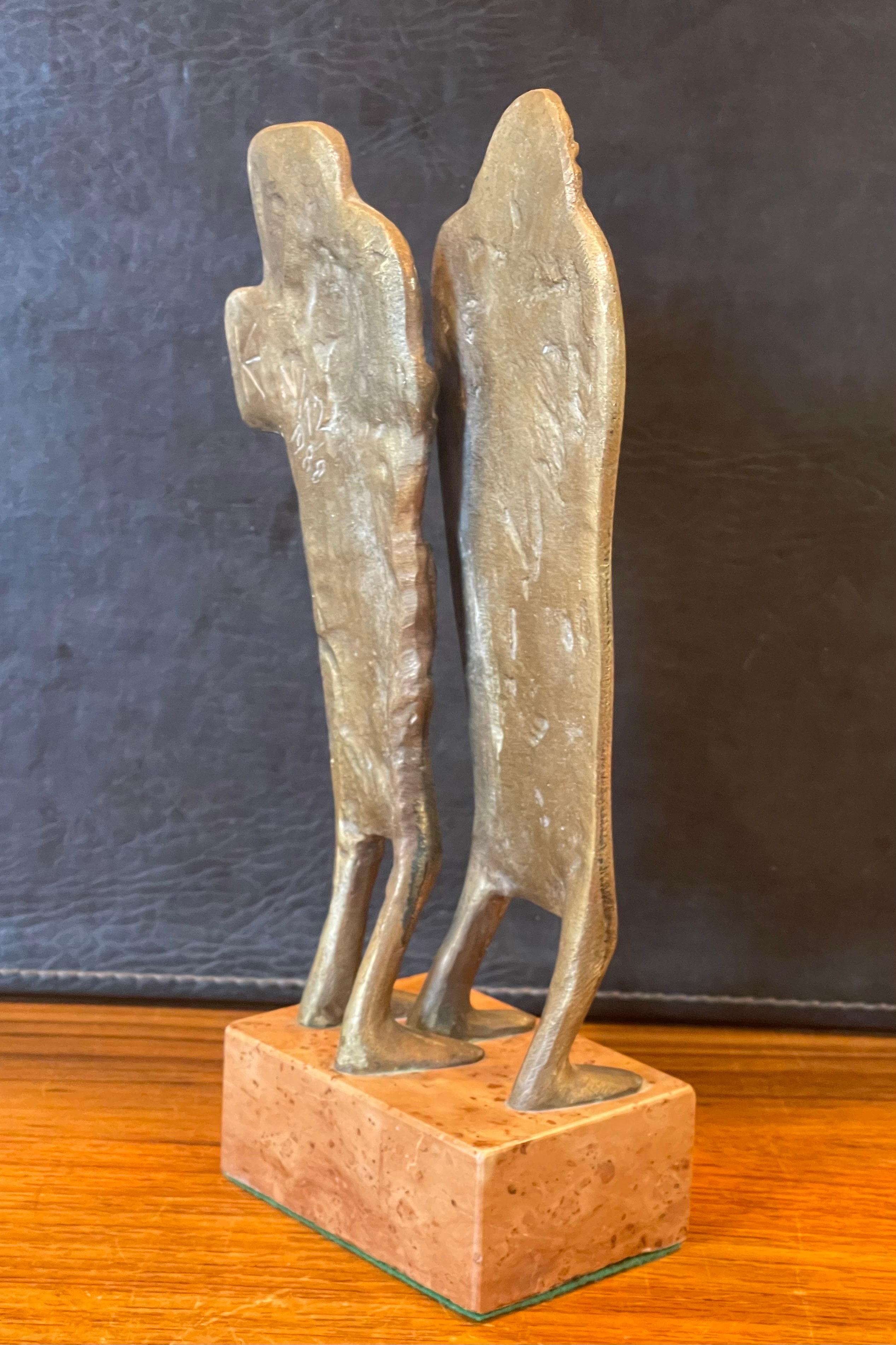 A very interesting patinated bronze figurative sculpture on marble base signed 