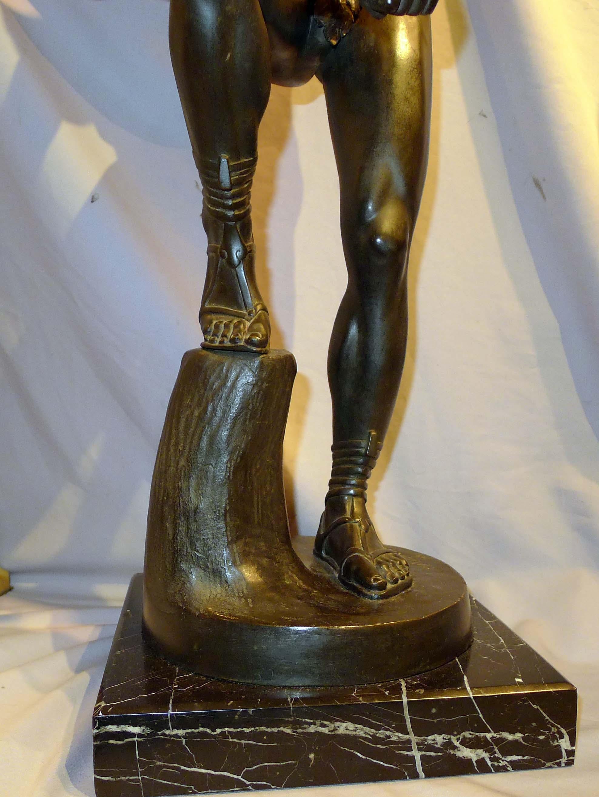 Antique patinated bronze figure of a Warrior by Withelm Posoreck. Of great size and set upon a marble base. The Spartan warrior is breaking a blade over his knee. Superb musculature to the body of the warrior.