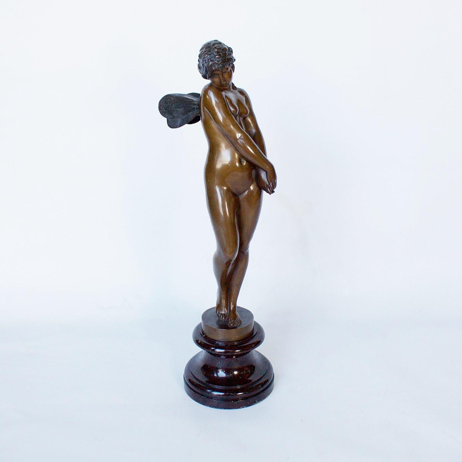 A patinated bronze figure of a winged Nymph interlocking her hands in a virtuous pose. Set over variegated marble plinth. Signed G.H. Eberlein to cast. 

Artist: Gustav Heinrich Eberlein (1847-1926)

Dimensions: H 41.5 cm, W 11 cm, D 14