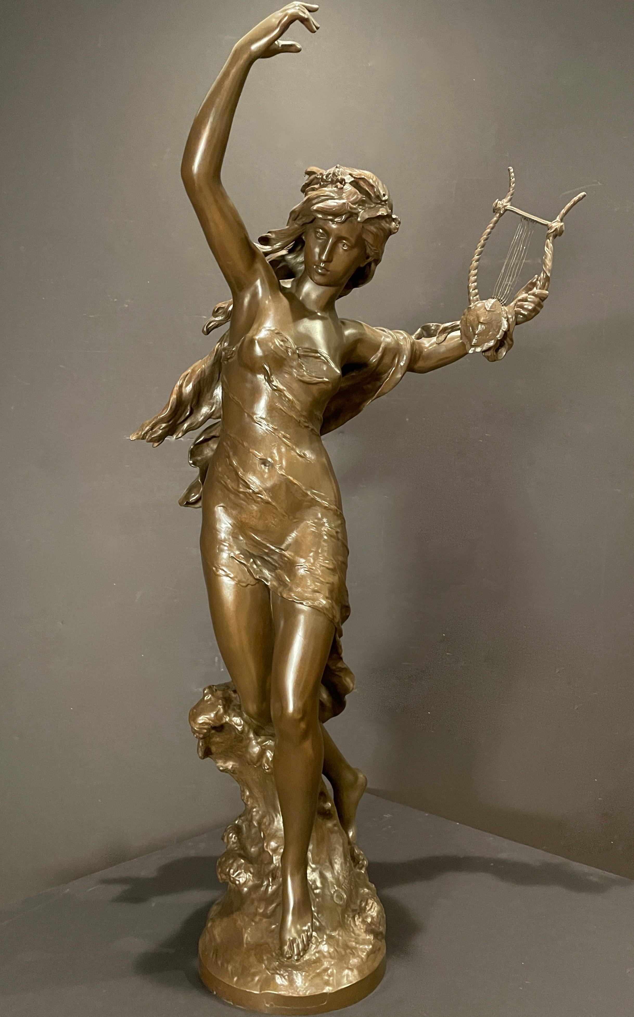 Mathurin Moreau (French, 1822-1912), Danseuse a la Lyre, a bronze figure of a woman with her arms raised holding a lyre, signed 