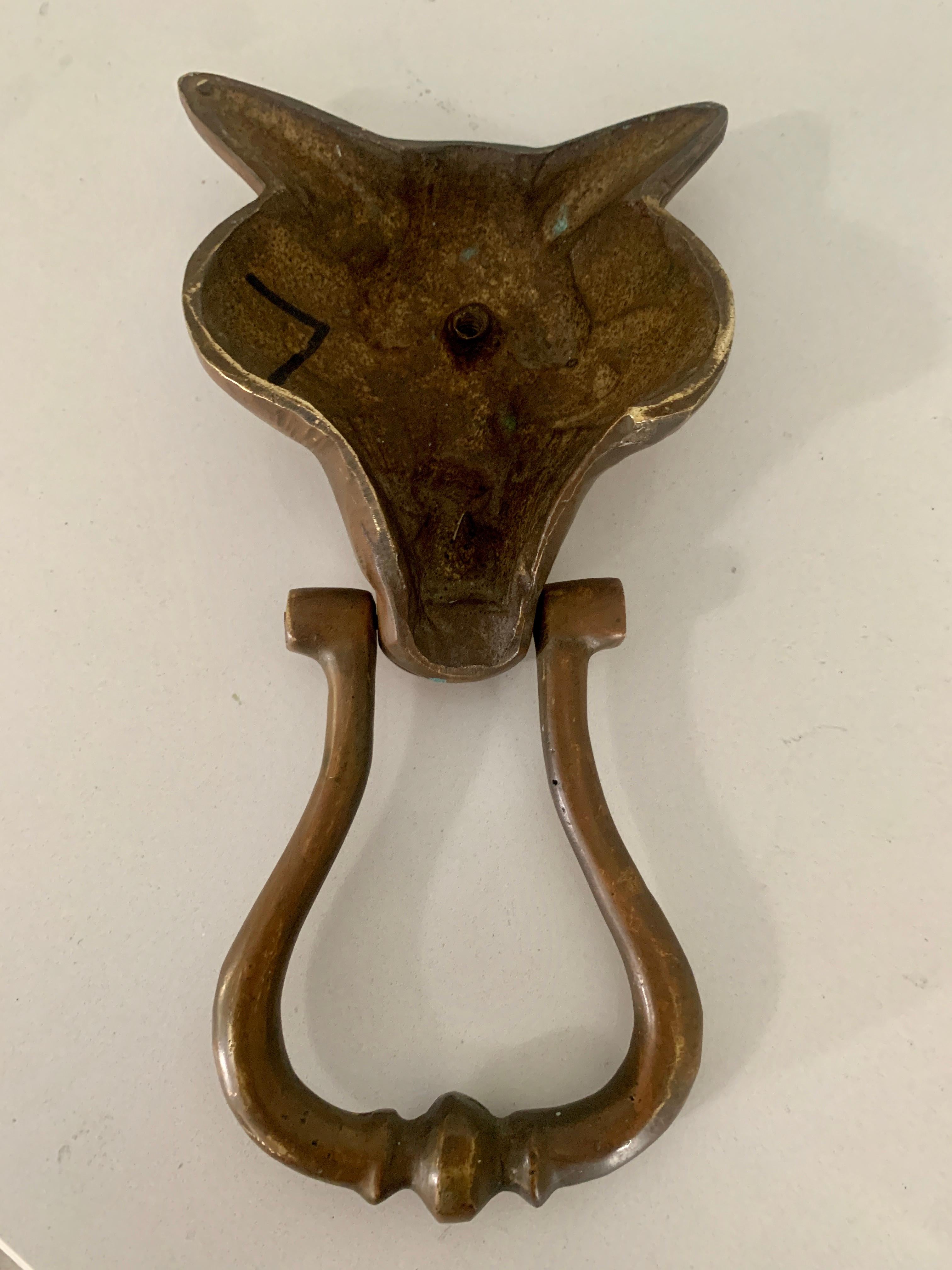 Patinated Bronze Fox Door Knocker - a wonderful knocker for your door, front, rear or side entrance. In Lore - In many cultures, the fox appears in folklore as a symbol of cunning and trickery, or as a familiar animal possessed of magic powers. In