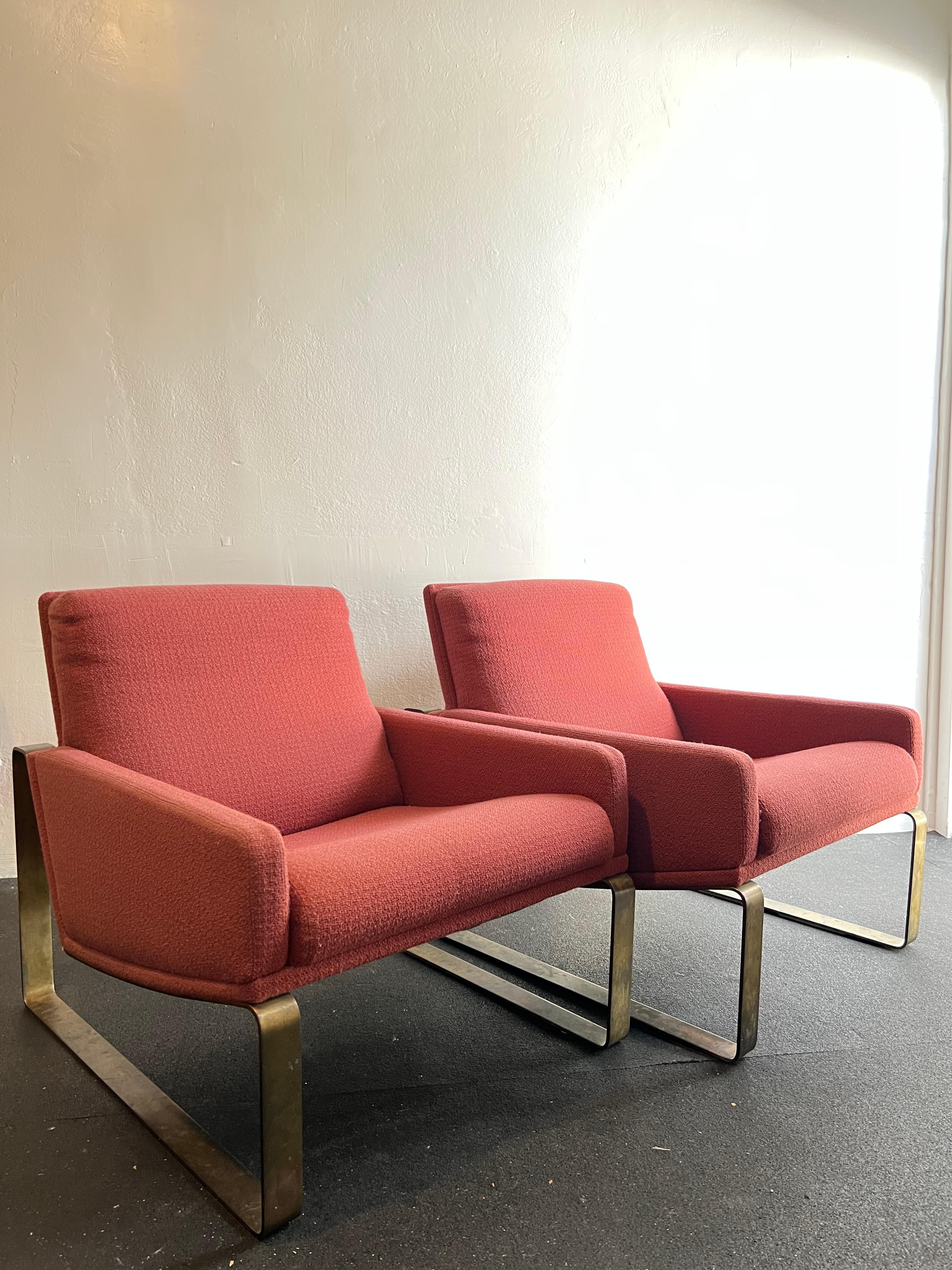 Pair of patinated bronze frame lounge chairs. Reupholstery is highly recommended. Beautiful patina throughout the bronze frames with slight loss underneath due to contact with ground (please refer to photos). Additional photos available upon