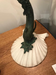 Patinated Bronze Grotto Style Sculptural Lamp Representing a Stylized Dolphin