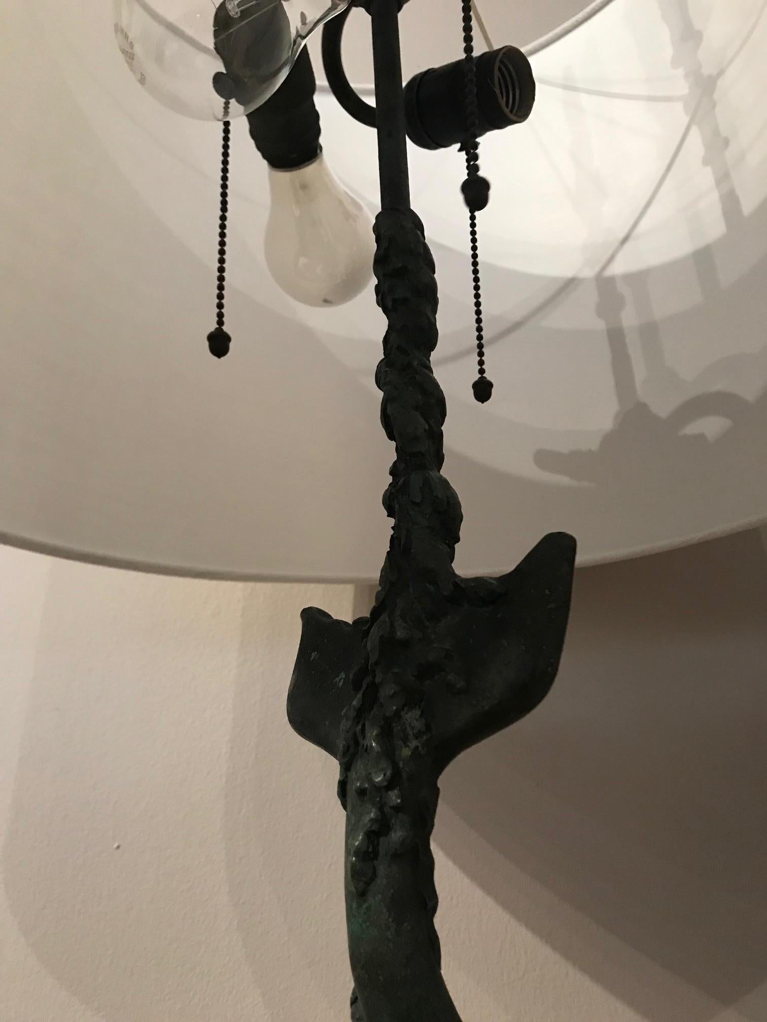 American Patinated Bronze Grotto Style Sculptural Lamp Representing a Stylized Dolphin For Sale