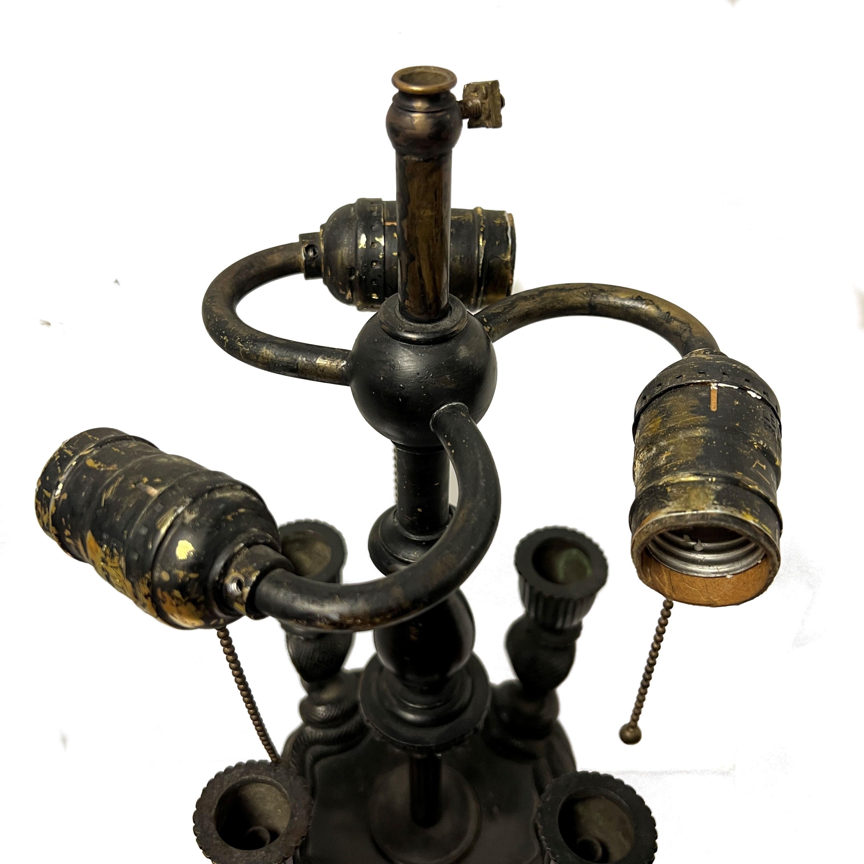 Patinated bronze lamp in Manner of Armand-Albert Rateau with snake motif . 
Attributed to Caldwell.