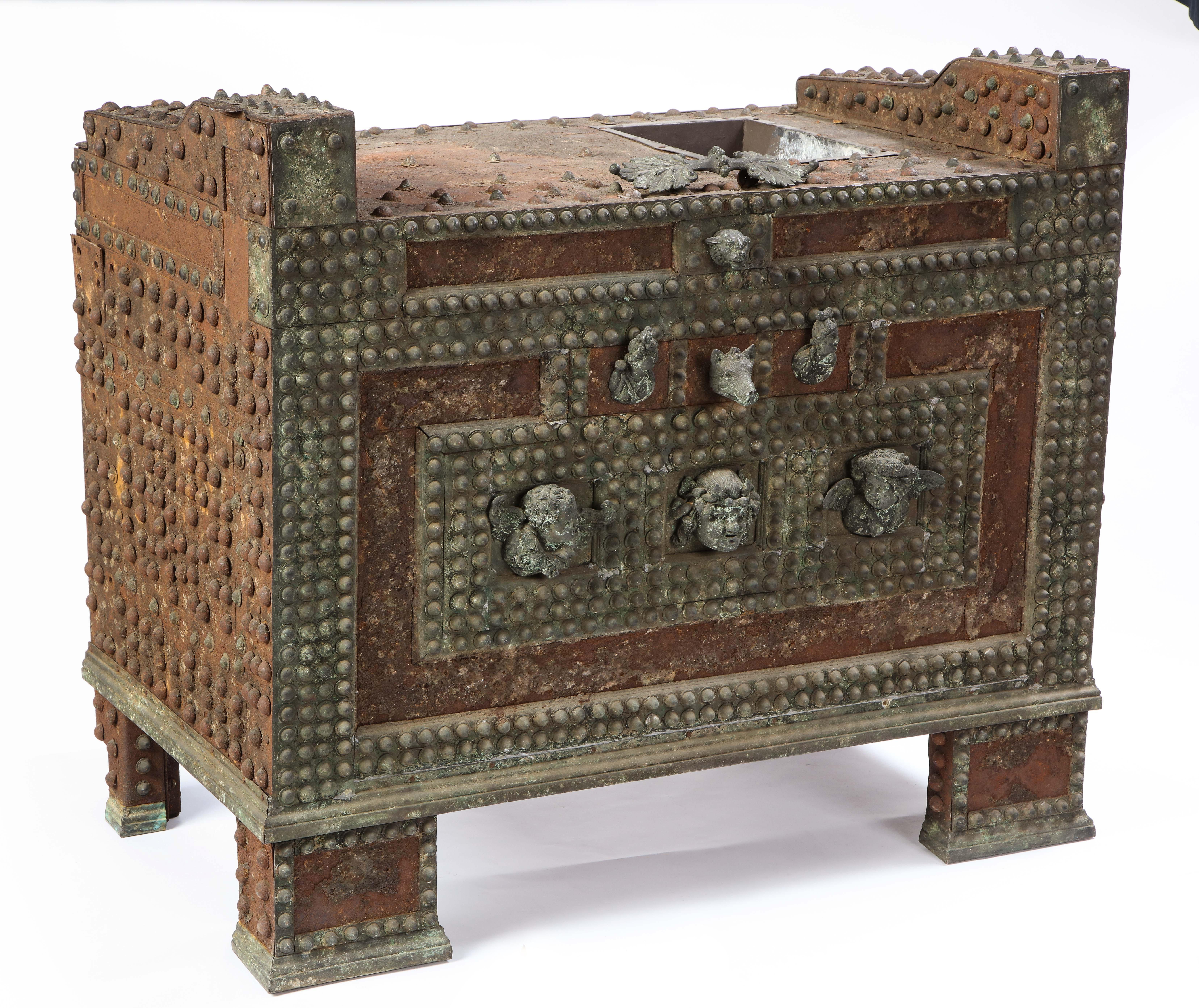 A 20th century patinated-bronze model of a safe based on an example from Pompeii . Said to be originally from the Andrew Carnegie collection, this is a truly distinct piece that can serve as an accent to any room. The small and intricate details
