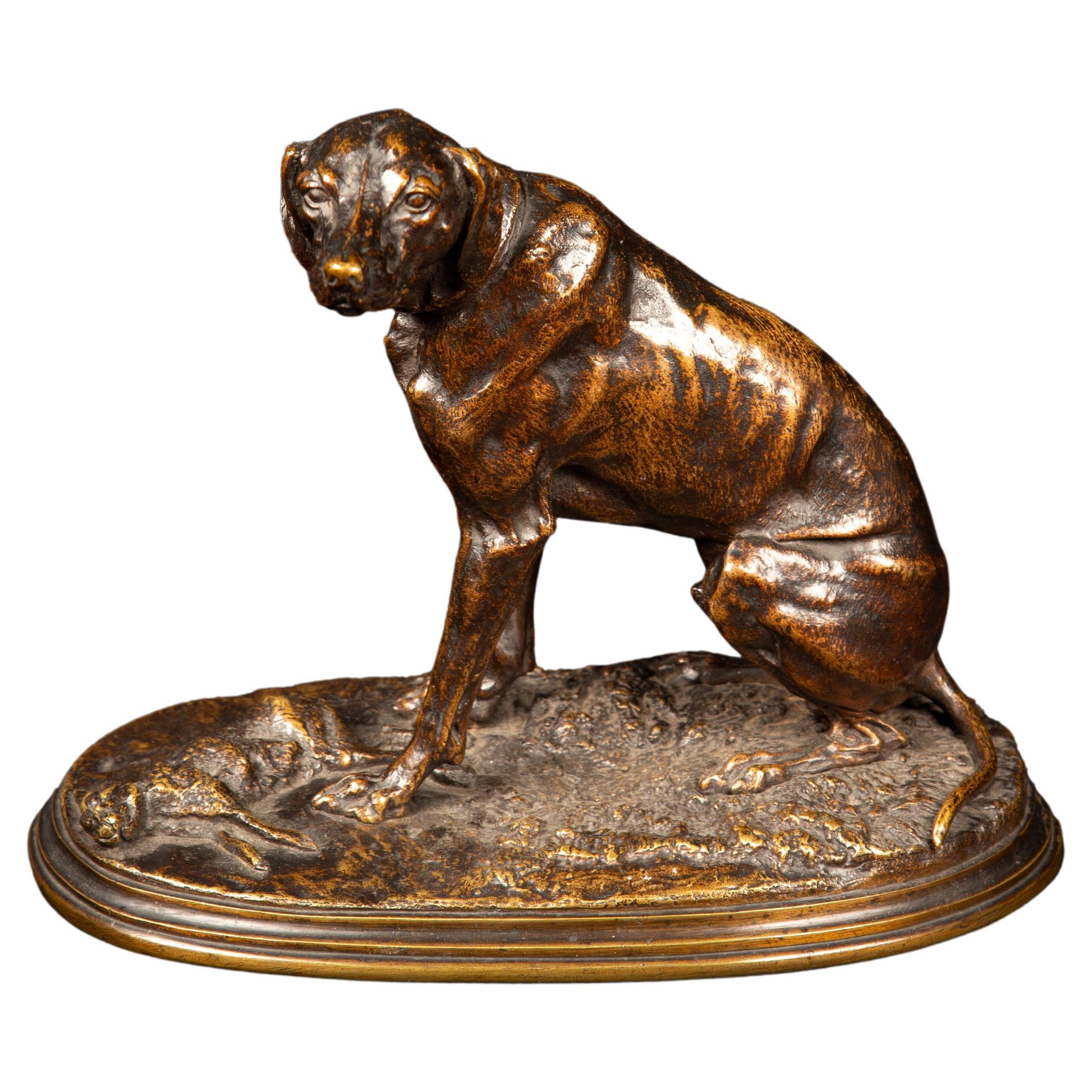 Bronze patiné d'un chien de chasse ayant ramené son hare en vente