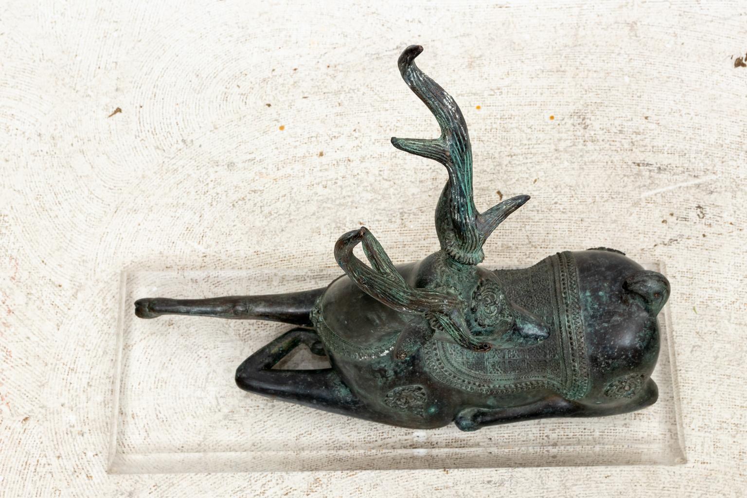 20th Century Patinated Bronze Reclining Deer Sculpture For Sale