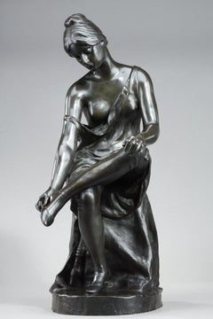 Patinated bronze sculpture, "Jeune femme se déchaussant", signed Malvina Brach