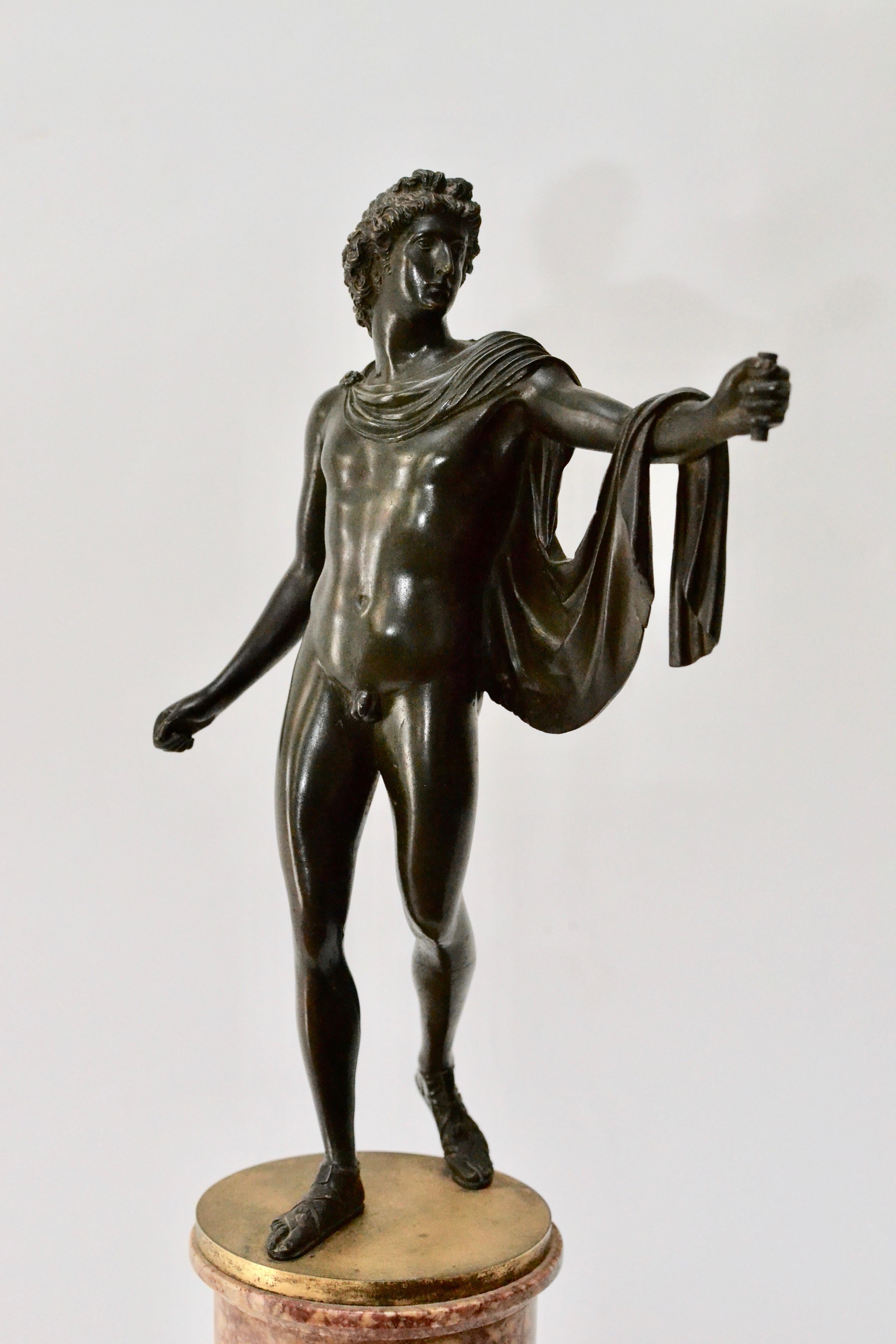 A patinated bronze sculpture of Apollo with an ormolu-mounted marble base. Probably, Italy, 19th century.