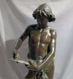 Patinated bronze sculpture of young boy trimming the wings of a dove by Gregoire