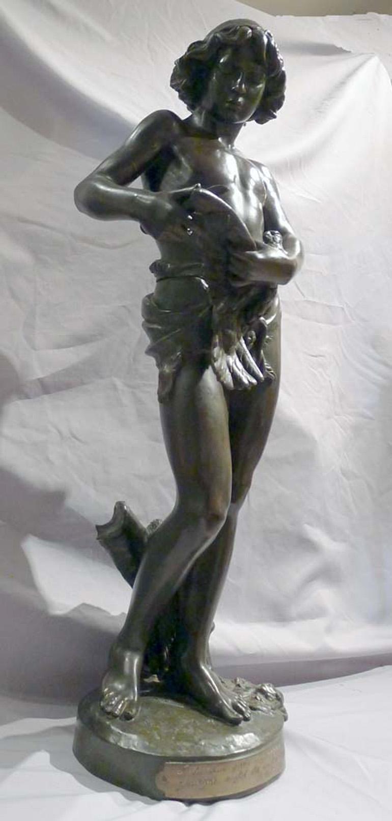 Patinated bronze sculpture of young boy trimming the wings of a dove by Gregoire In Good Condition For Sale In London, GB